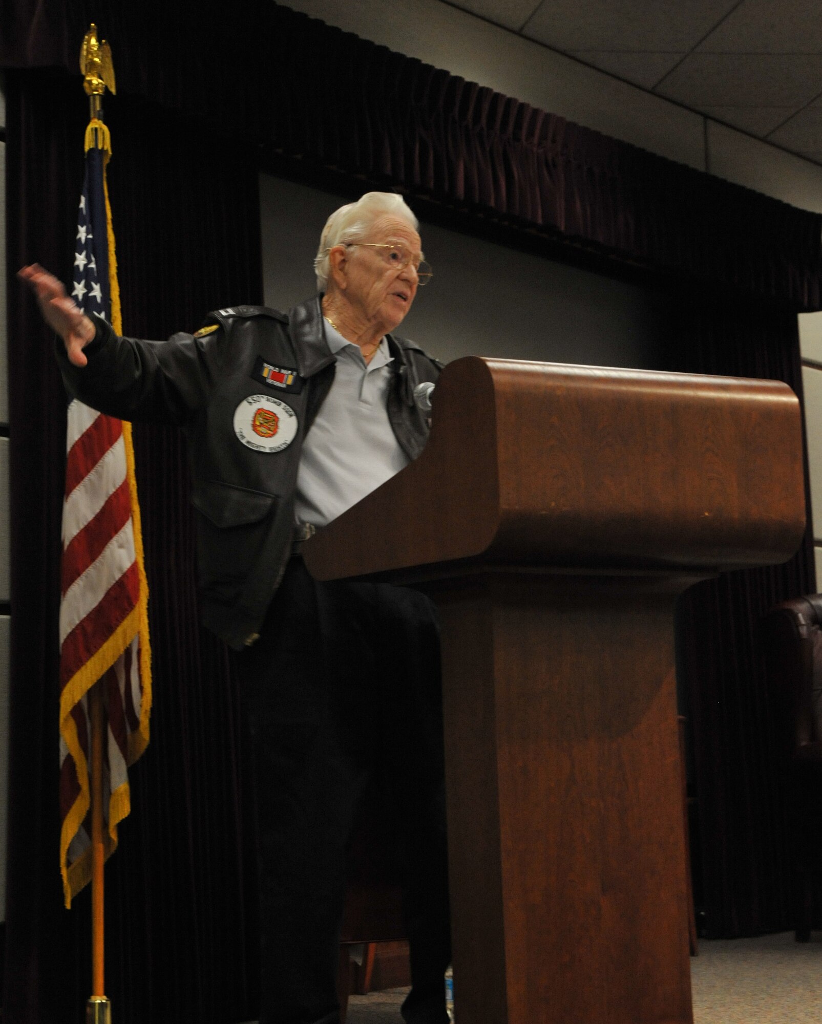 Dr. Lew Smith, U.S. Army Air Corps B-17 combat pilot, speaks to more than 60 McConnell Airmen about his experiences during World War II Oct. 18, 2012, McConnell Air Force Base, Kan. Smith is a member of the Commemorative Air Force Jayhawk Wing, a local group that honors American Military Aviation. (U.S. Air Force photo/Staff Sgt. Abigail Klein)