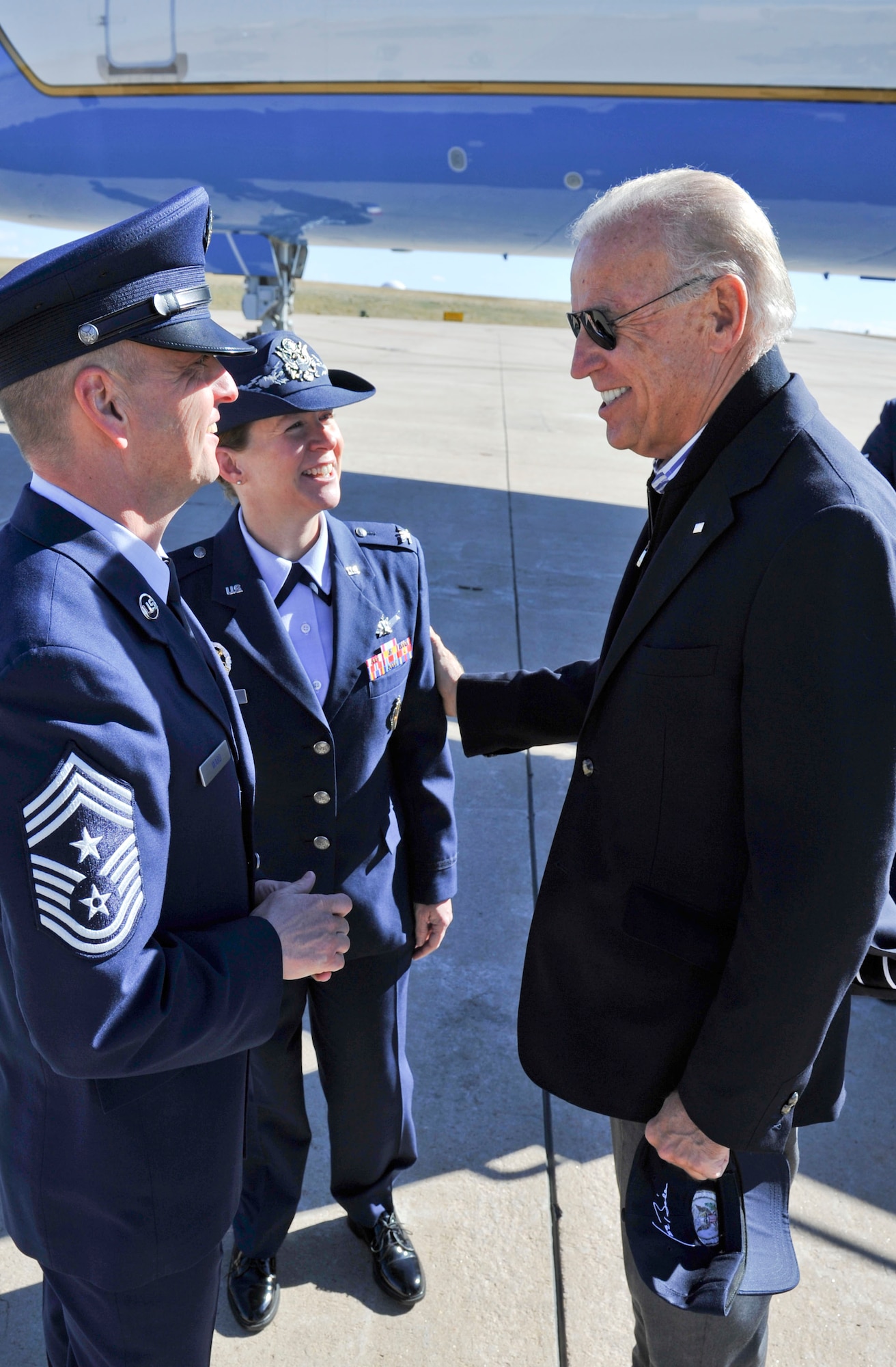 BUCKLEY AIR FORCE BASE, Colo. – Vice President Joe Biden greets Col. Tracey Hayes, 460th Space Wing vice commander, and Chief Master Sgt. William Ward, 460th SW command chief, Oct. 17, 2012. Biden’s plane landed at Buckley and he was transported to another destination in the local area. (U.S. Air Force photo by Senior Airman Christopher Gross)