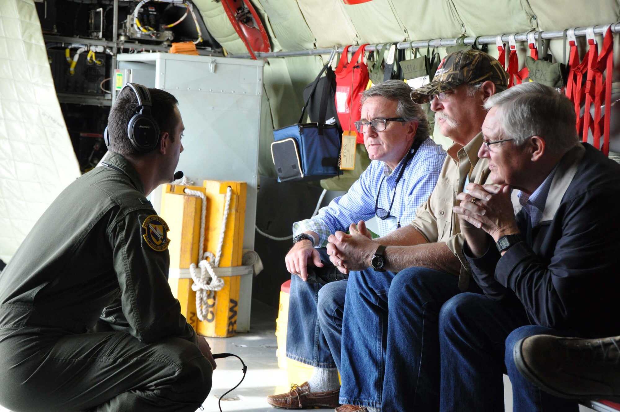 1st Lt. Frank Simon, pilot with the 911th Air Refueling Squadron and a resident of Clayton, talks with (from left to right) Jeff Carver, Johnston County Commissioner, Barry Partlo, owner of Agri-Supply in Garner and Mike Grannis, owner of Clayton Steak House, Morning Glory Inn and Mayor Pro Tem of Clayton. The three business and community leaders were part of a civic leader orientation flight sponsored by the 916th Air Refueling Wing at Seymour Johnson AFB. (Photo by Maj. Shannon Mann, 916th ARW Public Affairs Office)