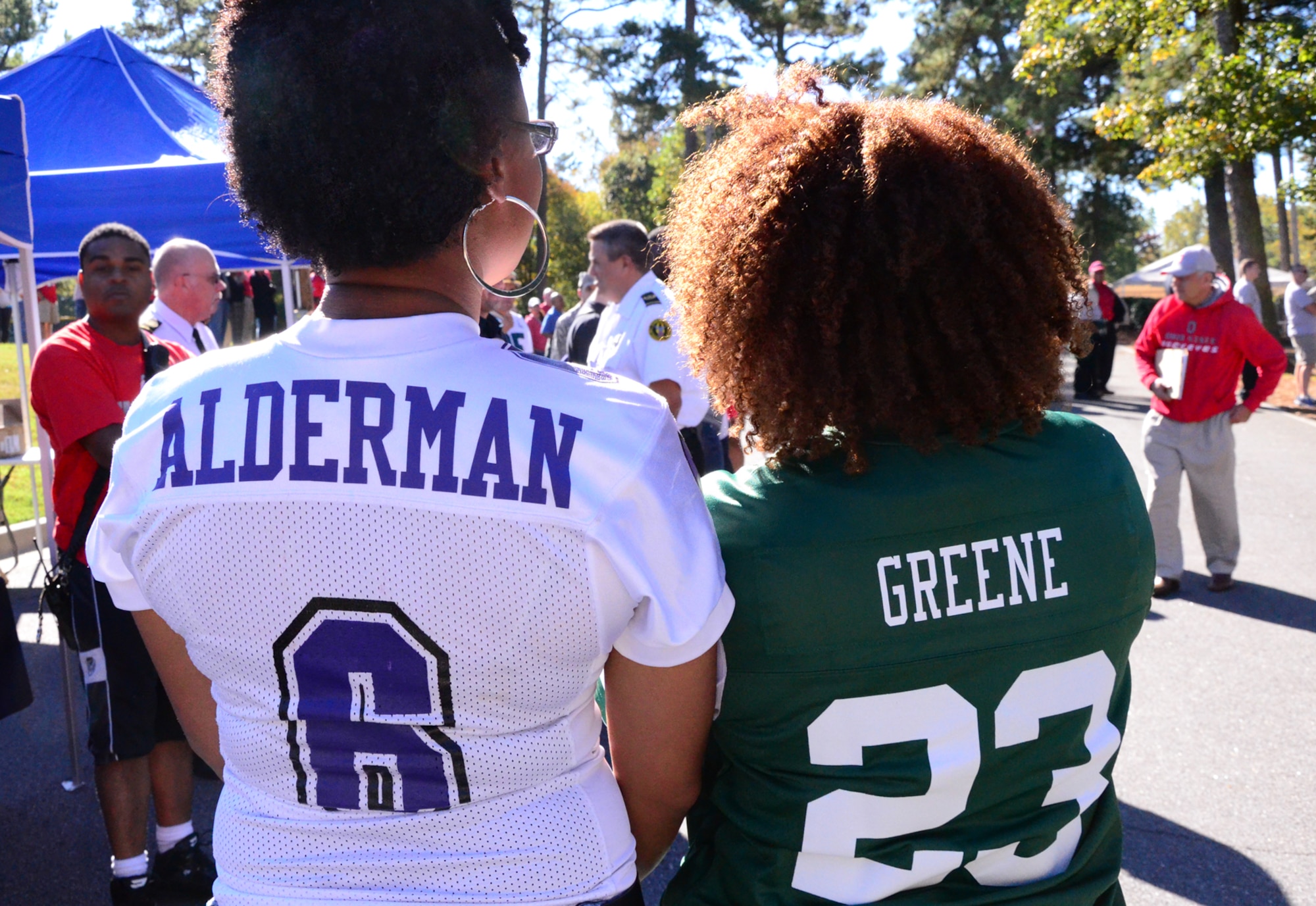 Capts Melissa Greene and Tameka Alderman proudly sport their team jerseys at the Annual 94th Airlift Wing Team Day at Dobbins Air Reserve Base, Ga., Oct. 16. Team day is designed to promote team work and competitive spirit between units. (U.S. Air Force photo/ Senior Airman Elizabeth Van Patten)