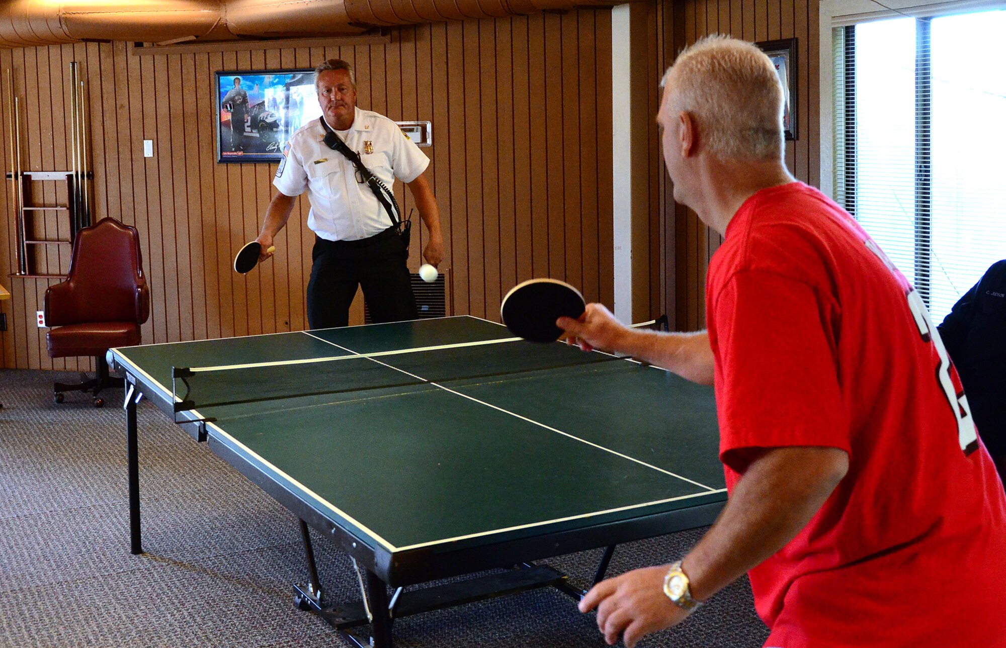 Teams compete in ping pong as one of 15 events at the Annual 94th Airlift Wing Team Day at Dobbins Air Reserve Base, Ga., Oct. 16. Team day is designed to promote team work and competitive spirit between units. (U.S. Air Force photo/ Senior Airman Elizabeth Van Patten)