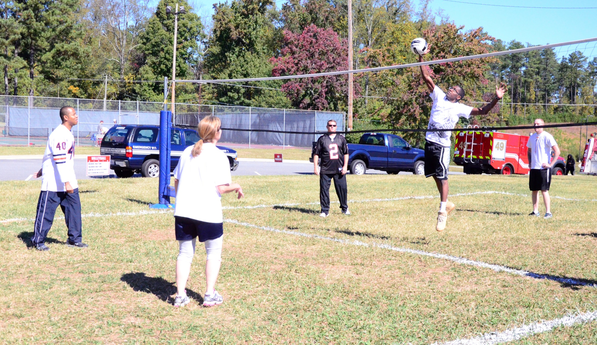 Teams compete in volleyball as one of 15 events at the Annual 94th Airlift Wing Team Day at Dobbins Air Reserve Base, Ga., Oct. 16. Team day is designed to promote team work and competitive spirit between units. (U.S. Air Force photo/ Senior Airman Elizabeth Van Patten)