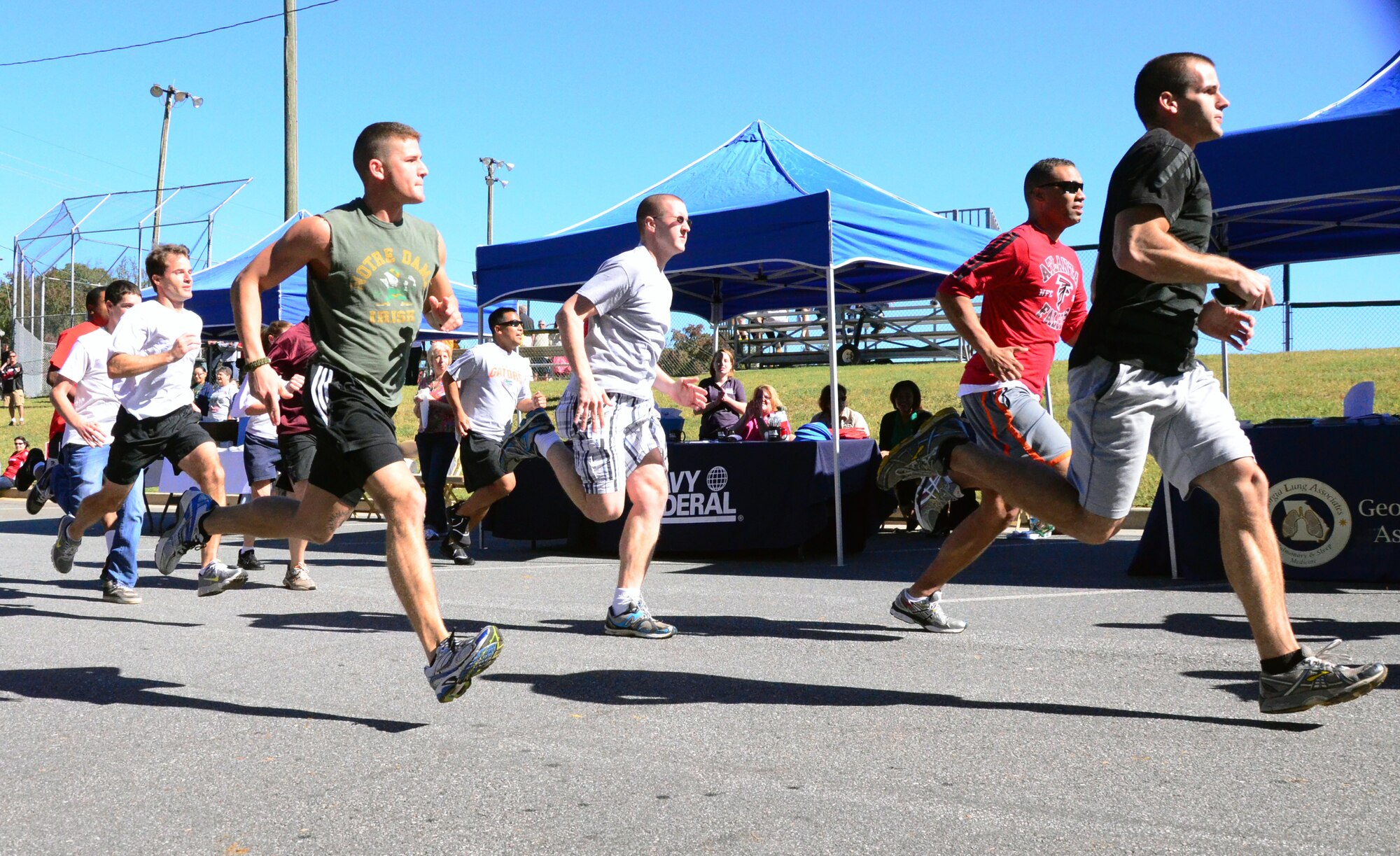 A fun run officially kicks off the Annual 94th Airlift Wing Team Day held at Dobbins Air Reserve Base, Ga., Oct. 16. Team day is designed to promote team work and competitive spirit between units. (U.S. Air Force photo/Senior Airman Elizabeth Van Patten)
