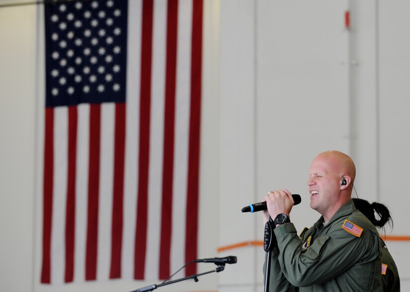 Master Sgt. Ryan Carson, U.S. Air Force Band Max Impact vocalist, performs for personnel from the Embassy of the Federal Republic of Germany in Washington D.C., during a tour to Joint Base Andrews, Md., Oct. 17, 2012. Max Impact is the premier rock band of the United States Air Force. The band's six members perform classic and current rock and country hits, as well as patriotic favorites and original music. (U.S. Air Force photo/ Staff Sgt. Nichelle Anderson)(Released)