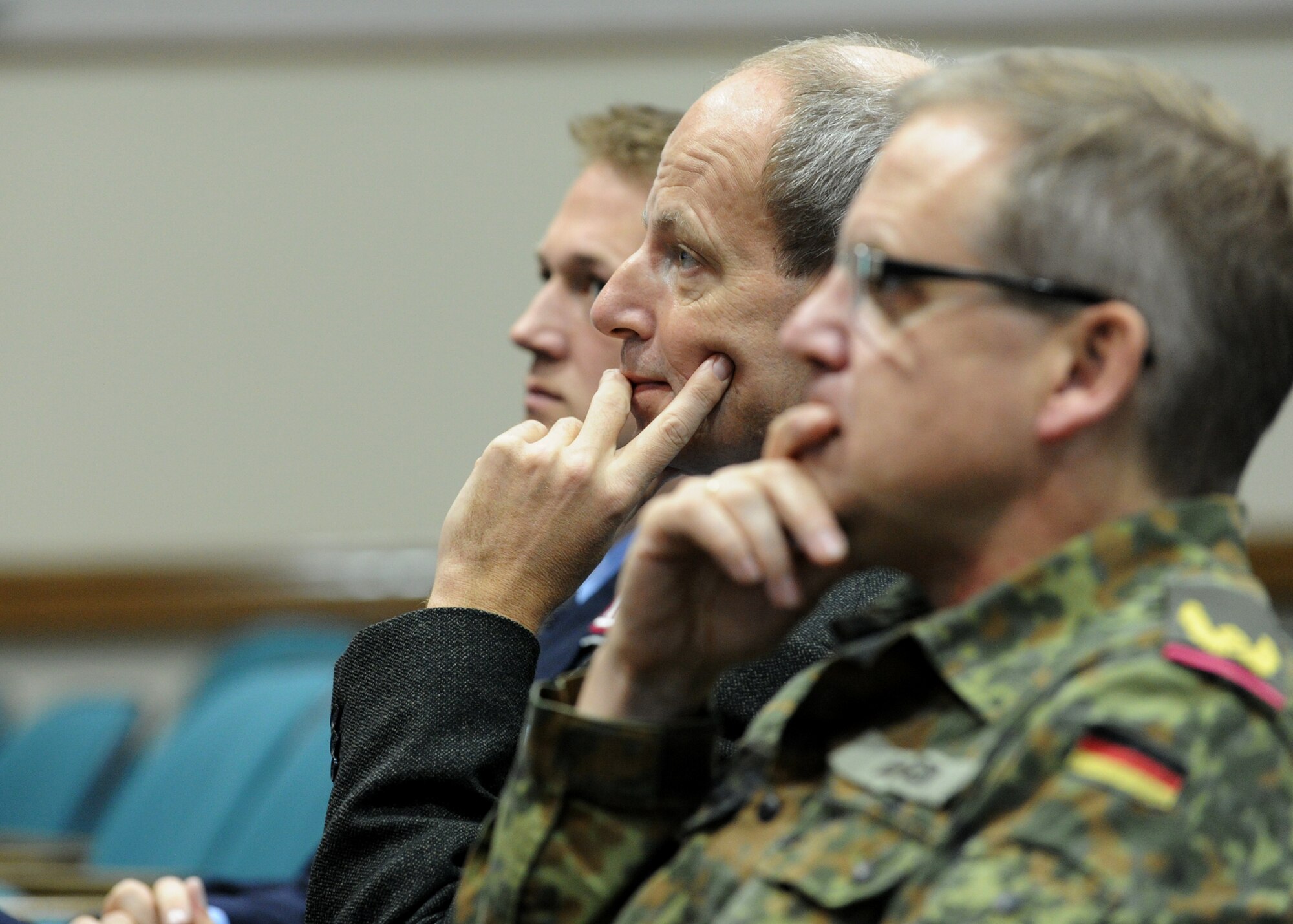 Personnel from the Embassy of the Federal Republic of Germany in Washington, D.C., listen to Col. Bill Knight, 11th Wing/ Joint Base Andrews commander, give a mission before a tour here, Oct. 17, 2012. (U.S. Air Force photo/ Staff Sgt. Nichelle Anderson)(Released)