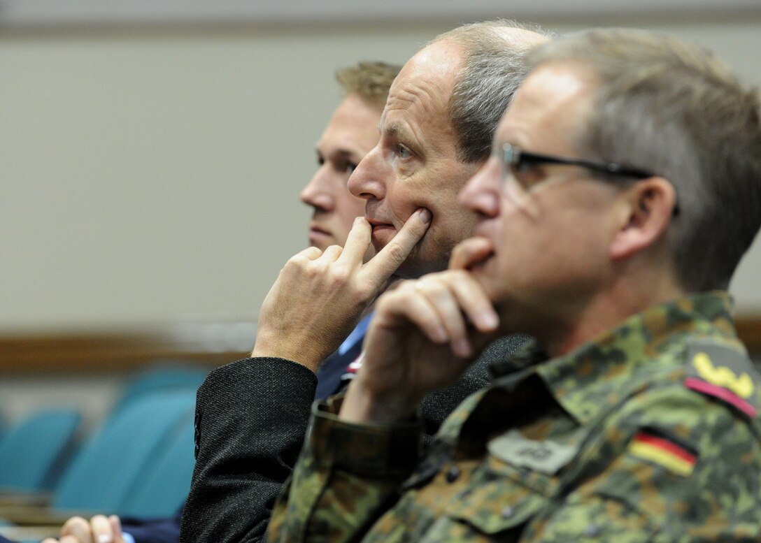 Personnel from the Embassy of the Federal Republic of Germany in Washington, D.C., listen to Col. Bill Knight, 11th Wing/ Joint Base Andrews commander, give a mission before a tour here, Oct. 17, 2012. (U.S. Air Force photo/ Staff Sgt. Nichelle Anderson)(Released)