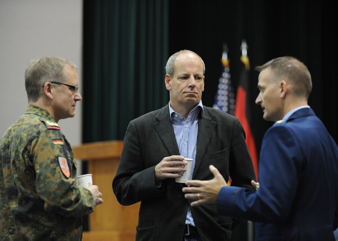 Defense attaché from the Embassy of the Federal Republic of Germany in Washington, D.C., German, Brig. Gen. Dirk Heinrich Backen, and Jens Hanefeld, Embassy of the Federal Republic of Germany in Washington, D.C., minister deputy chief of mission, engage in conversation  with Col. Bill Knight 11th Wing/Joint Base Andrews commander, prior to an 11th Wing mission brief here Oct. 17, 2012. (U.S. Air Force photo/ Staff Sgt. Nichelle Anderson)(Released)