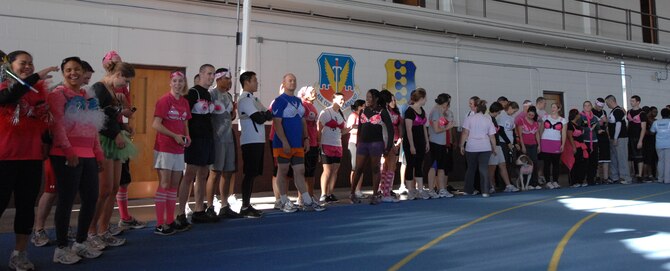 Contestants donning an array of unique, colorful bras prepare to be judged during a contest in the Pride Hangar prior to the start of the Breast Cancer Awareness 5k, at Ellsworth Air Force Base, S.D. on Oct. 12., 2012. Participants decorated their own bras in support of breast cancer survivors, wearing them over T-shirts for the event. (U.S. Air Force photo by Airman 1st Class Audra M. Hornbacher)