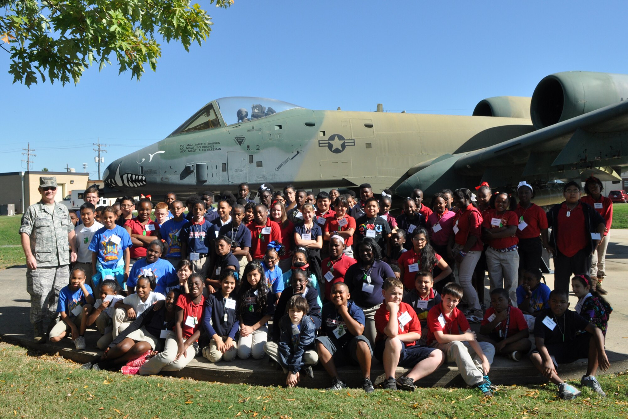 A group of 5th Grade students from Plantation Park Elementary School pose for a group photo with Master Sgt. Jeff Walston, a public affairs technician assigned to the 307th Bomb Wing at Barksdale Air Force Base, La., Oct. 18, 2011. Walston took time to explain engine thrust, speed and capabilities of the A-10 Thunderbolt II for the students during their visit to the 307th BW. The students are attending STARBASE Louisiana, at Barksdale, one of 60 national STARBASE sites. It is sponsored by the 307th BW of the Air Force Reserve Command. The STARBASE program presents an exciting 25-hour hands on/minds on aviation and aerospace curriculum to area 5th grade students and their teachers. The DoD program is committed to addressing the critical needs in STEM education - Science, Technology, Engineering and Mathematics - STARBASE Louisiana introduces its students to exciting STEM education topics, inspiring these young minds to further explore these topics in future course work. (U.S. Air Force photo by Betty Stephens)