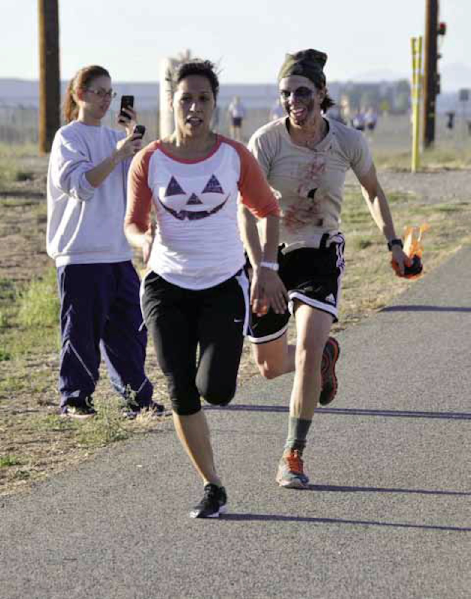 Military and civilians participated in the first March Field Zombie Run, Sunday, Oct. 14, 2012. The run was sponsored by the 452nd Air Mobility Wing Rising Six organization to raise money for junior enlisted ranks to attend the Military Ball. (U.S. Air Force photo by Master Sgt. Linda Welz)
