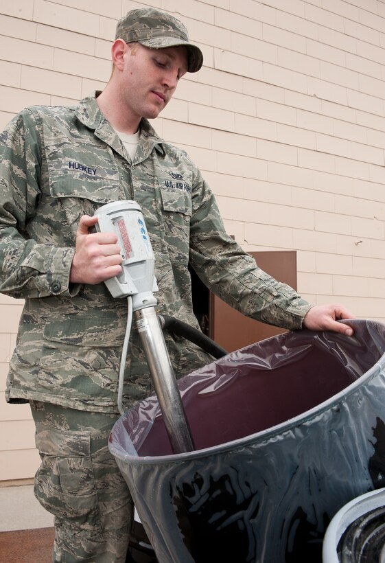 Airman 1st Class Clint Hubkey, 28th Civil Engineer Squadron heating, ventilation, and air conditioning technician, pumps glycol into a closed water system during winterization activities at Ellsworth Air Force Base, S.D., Oct. 16, 2012. The HVAC shop ensures that more than 320 buildings on base are prepared for harsh winter weather conditions. (U.S. Air Force photo by Airman 1st Class Alystria Maurer/Released)