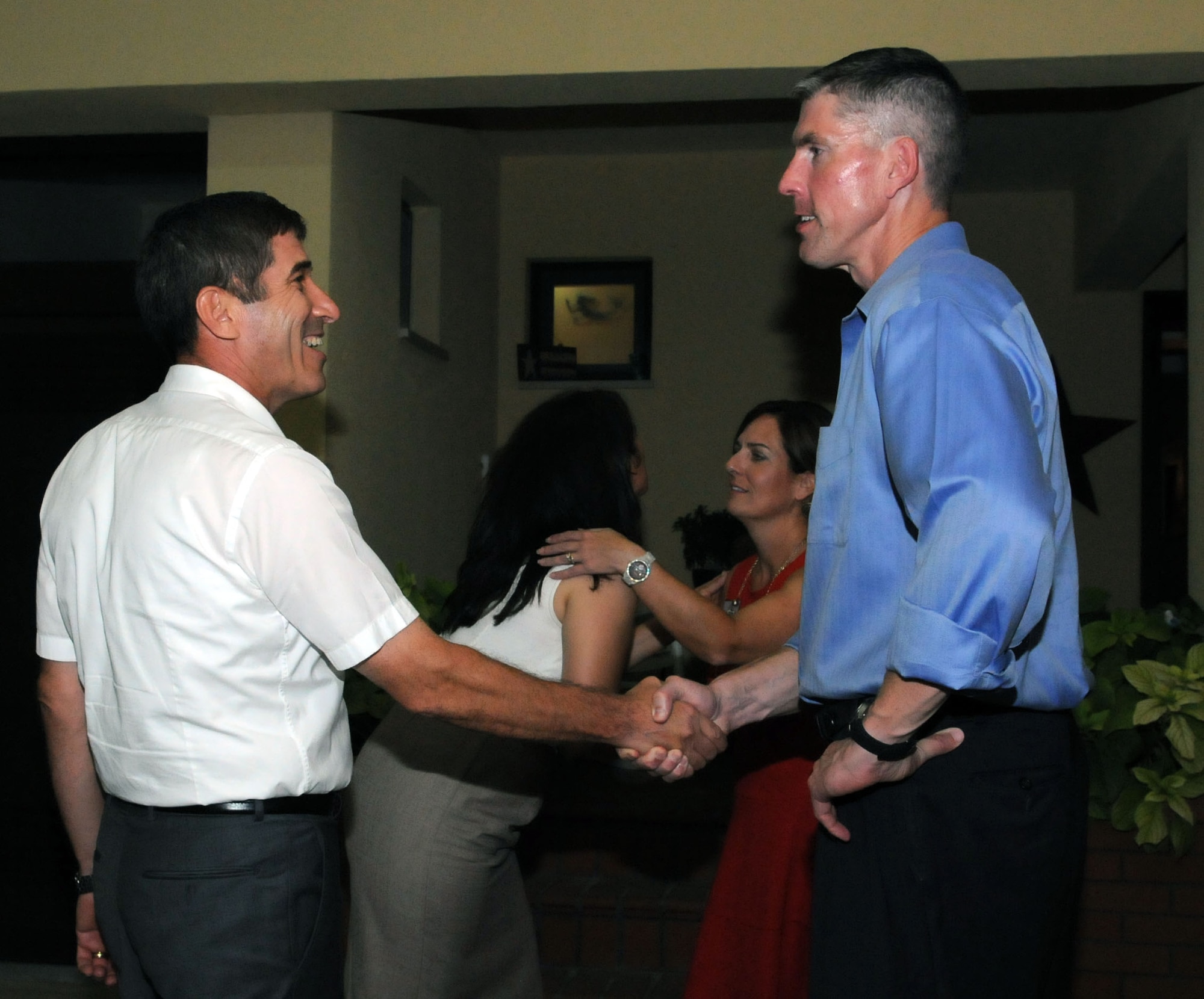 Turkish Air Force Brig. Gen. Serdar Gulbas, 10th Tanker Base commander and Col. Chris Craige, 39th Air Base Wing commander, shake hands before departing ways at the Turkish-American Social Sept. 29, 2012, at Incirlik Air Base, Turkey. Col. Craige and his wife, Penny, invited members of both the 10 Tanker command and the 39th ABW to their home for an evening of music, socializing and camaraderie.  U.S. and Turkish service members and civilians work together daily at Incirlik conducting patrols, providing sustenance services, maintaining housing and improving quality of life for Airmen and families.  (U.S. Air Force photo by Senior Airman Marissa Tucker)