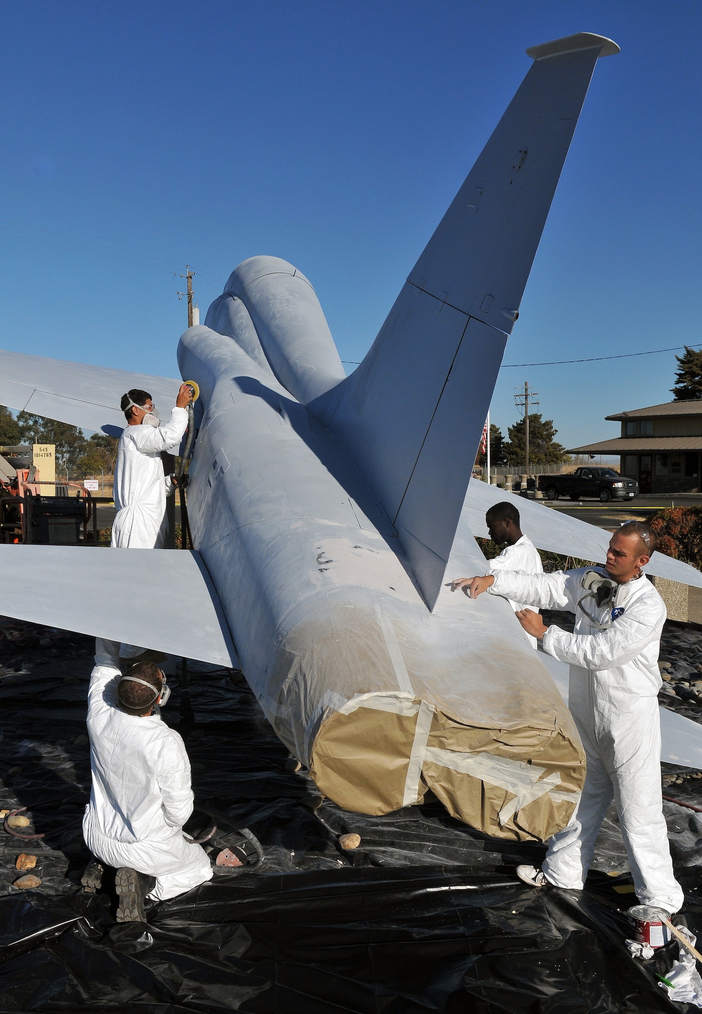 Employees of a Texas-based company restore a T-38 Talon static display at Beale Air Force Base, Calif., Oct. 16, 2012. The Talon static display is located at Beale’s main entrance. (U.S. Air Force photo by Senior Airman Rebeccah Anderson/Released)