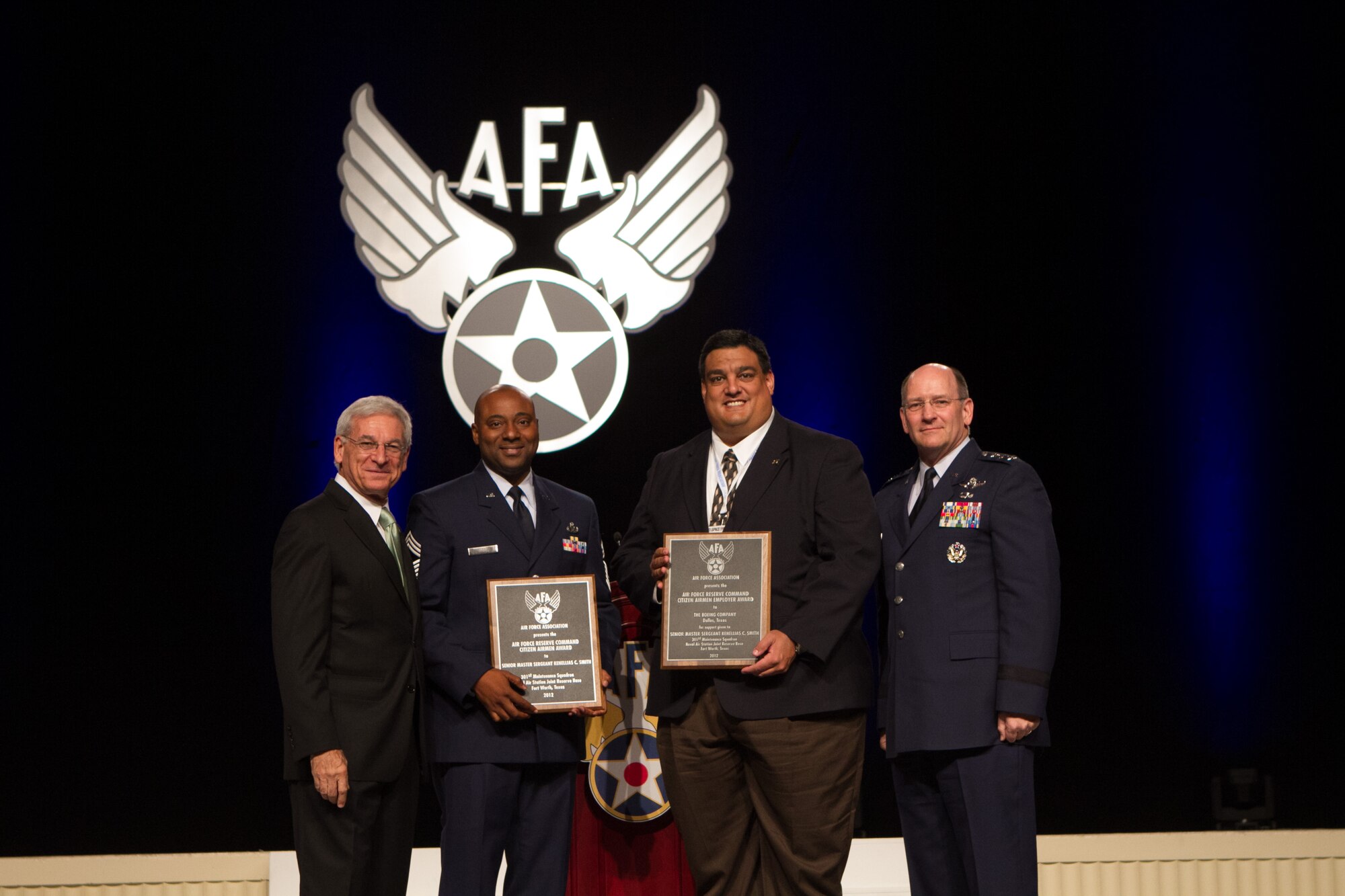 (Left to right) Air Force Association Chariman Sandy Schlitt, Chief Master Sgt. Kenellias Smith, Boeing Executive Director William Valencia, AFRC Commander Lt. Gen. James Jackson pose for photos at the U.S. Air Force Association Air and Space Conference in National Harbor, Md., Sept. 17, 2012. Chief Smith won the “2012 Citizen Airman of the Year” award and Boeing was awarded the “Air Force Reserve Command Citizen Airmen Employer” award. (Courtesy photo)