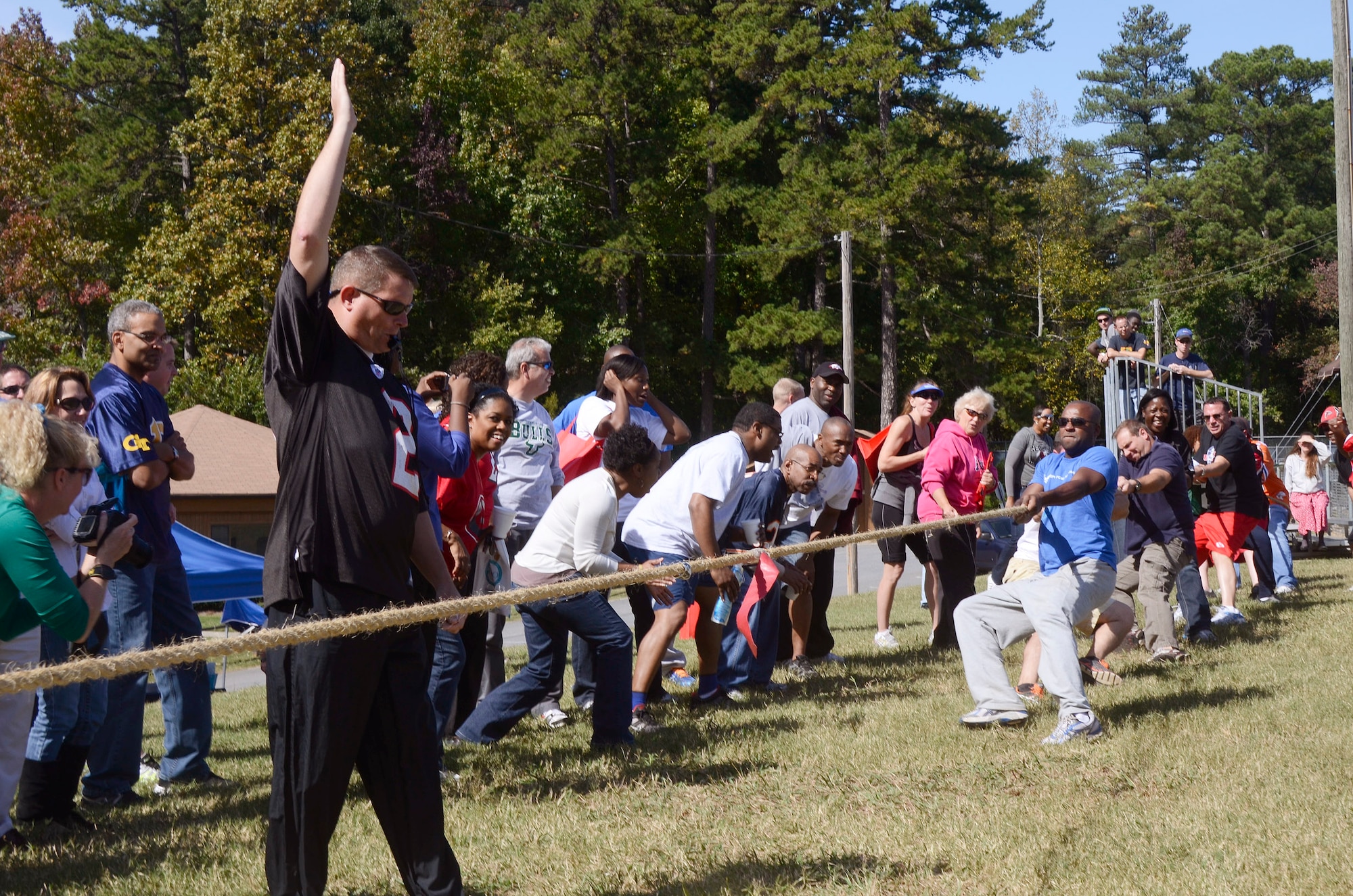 Senior Master Sgt. Rocky R. Epps, from the 94th Security Forces Squadron officiates as Teams battle it out at a Tug of war, capping off the day’s sporting events during the annual 94th Airlift Wing Team Day held at Dobbins Air Reserve Base, Ga., Oct. 16. Team day is designed to promote team work and competitive spirit between units. (U.S. Air Force photo/Don Peek)