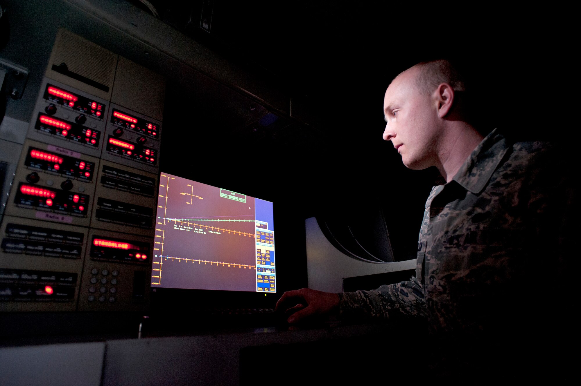 Airman 1st Class Derek McMullen, 87th Communications Squadron radar technician, checks to make sure that the MPN-25 Radar System is set working properly so aircraft can land safely on the proper glide slope and runway center line. (U.S. Air Force photo by Carlos Cintron Released)