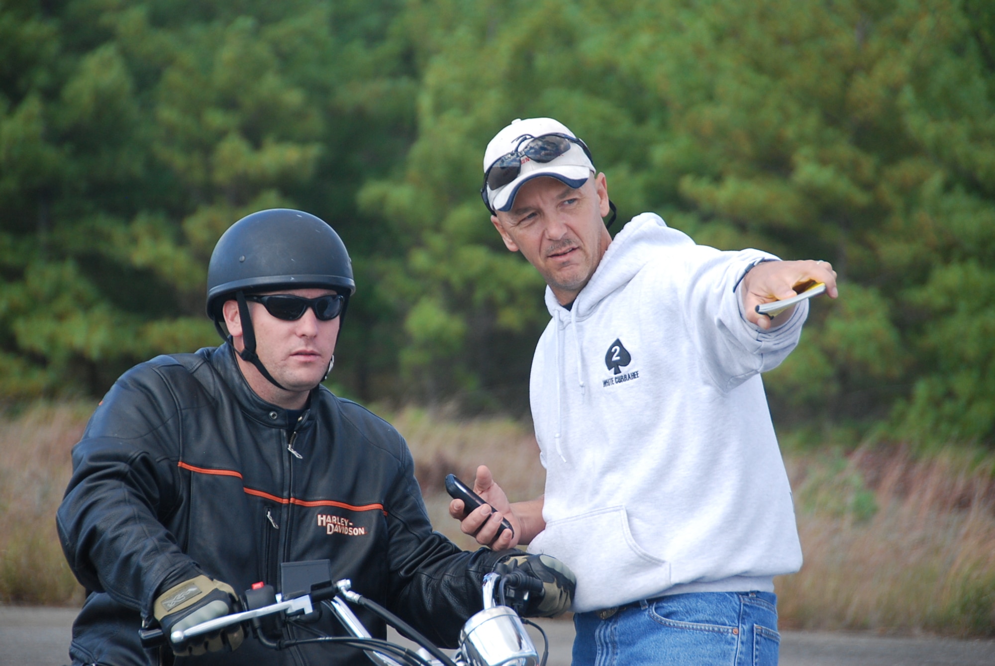 Staff Sgt. Stephen Blashfield, Basic Riders Course student, and Sgt. 1st Class John Moors, BRC instructor, discuss tactics to avoid hazards during the BRC practice skills test, Oct. 10 on Dix. All service members, authorized dependants and DOD civilians at Joint Base McGuire-Dix-Lakehurst interested in riding are offered the Basic Rider Course and BRC2 free of charge. The training courses are recognized by the New Jersey State Motor Vehicle Commission. (U.S. Army photo by Capt. Antonia Edwards/Released)