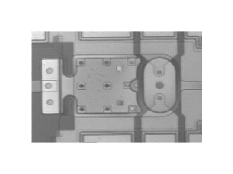 The hybrid packaged XCOM radio frequency (RF) microelectromechanical (MEMS) relay product. Nanoparticle lubricant (NPL) technology extended the lifecycle of noble metal ohmic contact RF MEMS switches developed for tactical radios.   (AFRL Image)