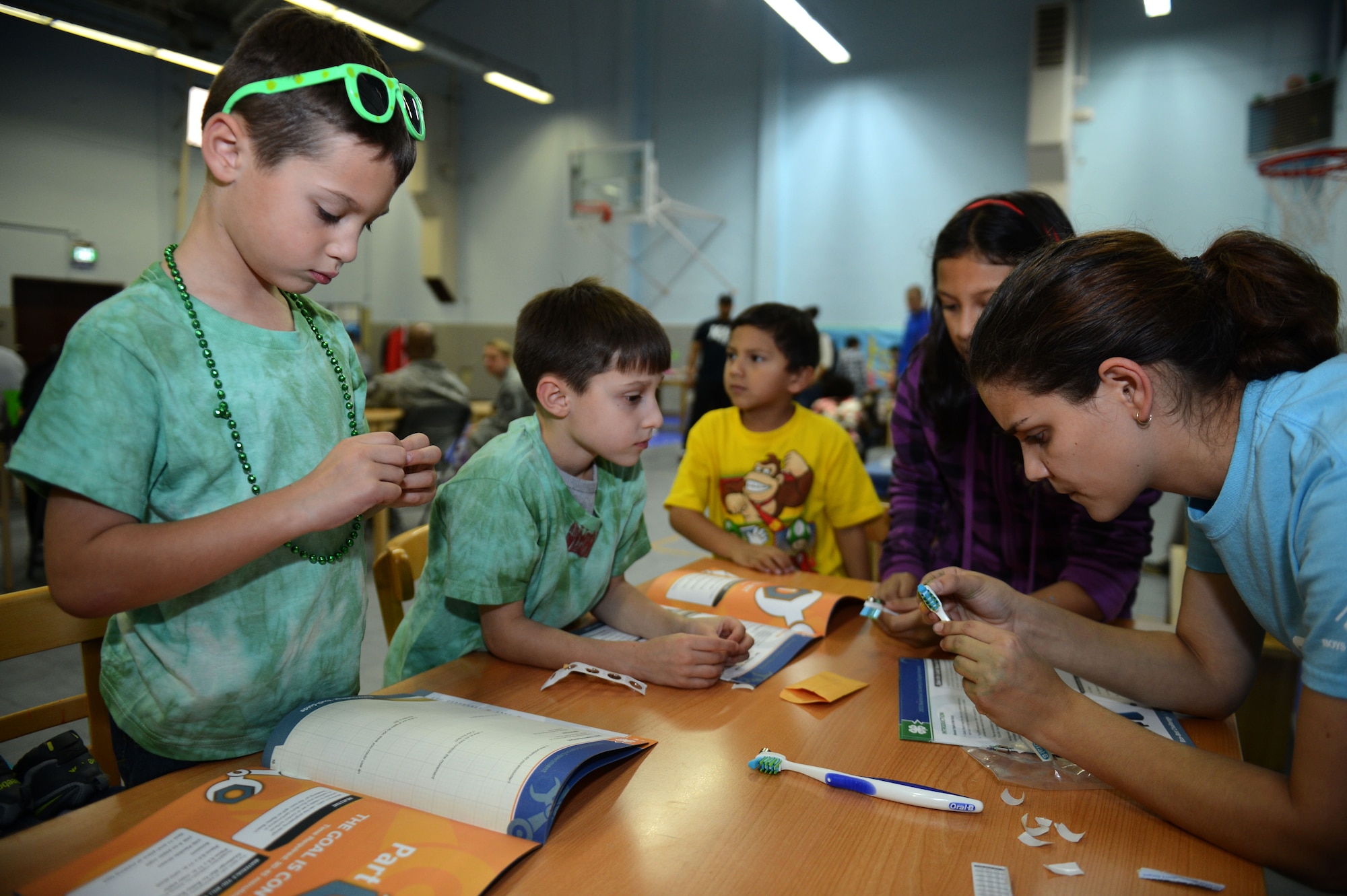 SPANGDAHLEM AIR BASE, Germany – Lights On Afterschool event participants create an ecological robot at the School Age Program Oct. 18, 2012.  The School Age Program hosts afterschool activities to keep kids safe, help working families and inspire learning. (U.S. Air Force photo by Airman 1st Class Gustavo Castillo/Released)