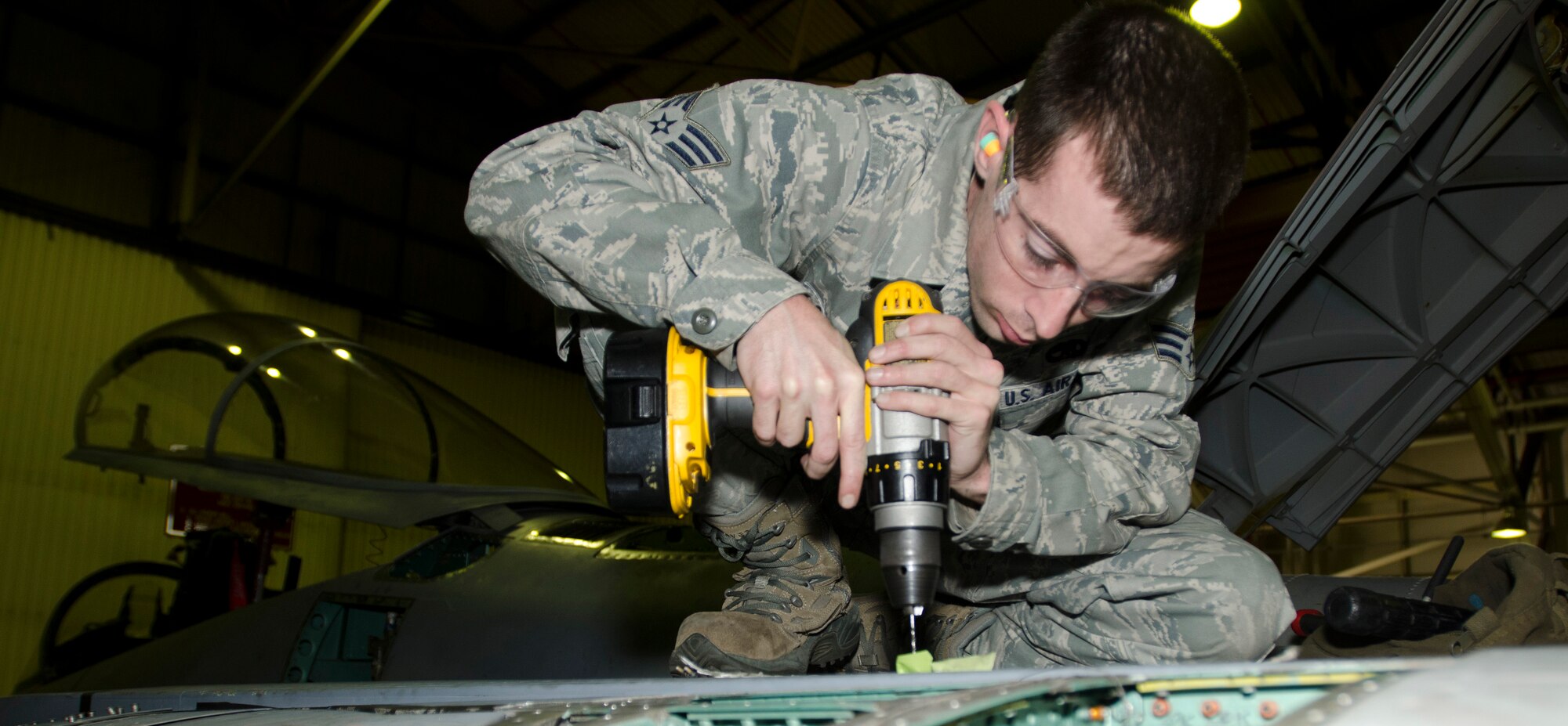 ROYAL AIR FORCE LAKENHEATH, England - Senior Airman David Campbell, 48th Equipment Maintenance Squadron aircraft structural journeyman and native of Sacramento, Calif., replaces a gang channel on top of an F-15C Eagle Oct. 17, 2012. The aircraft was turned over to the 48th EMS for 10 days of phase maintenance. During the maintenance, the 48th EMS Airmen essentially reverse 400 flight hours of wear and tear. (U.S. Air Force Photo by Staff Sgt. Stephen Linch)