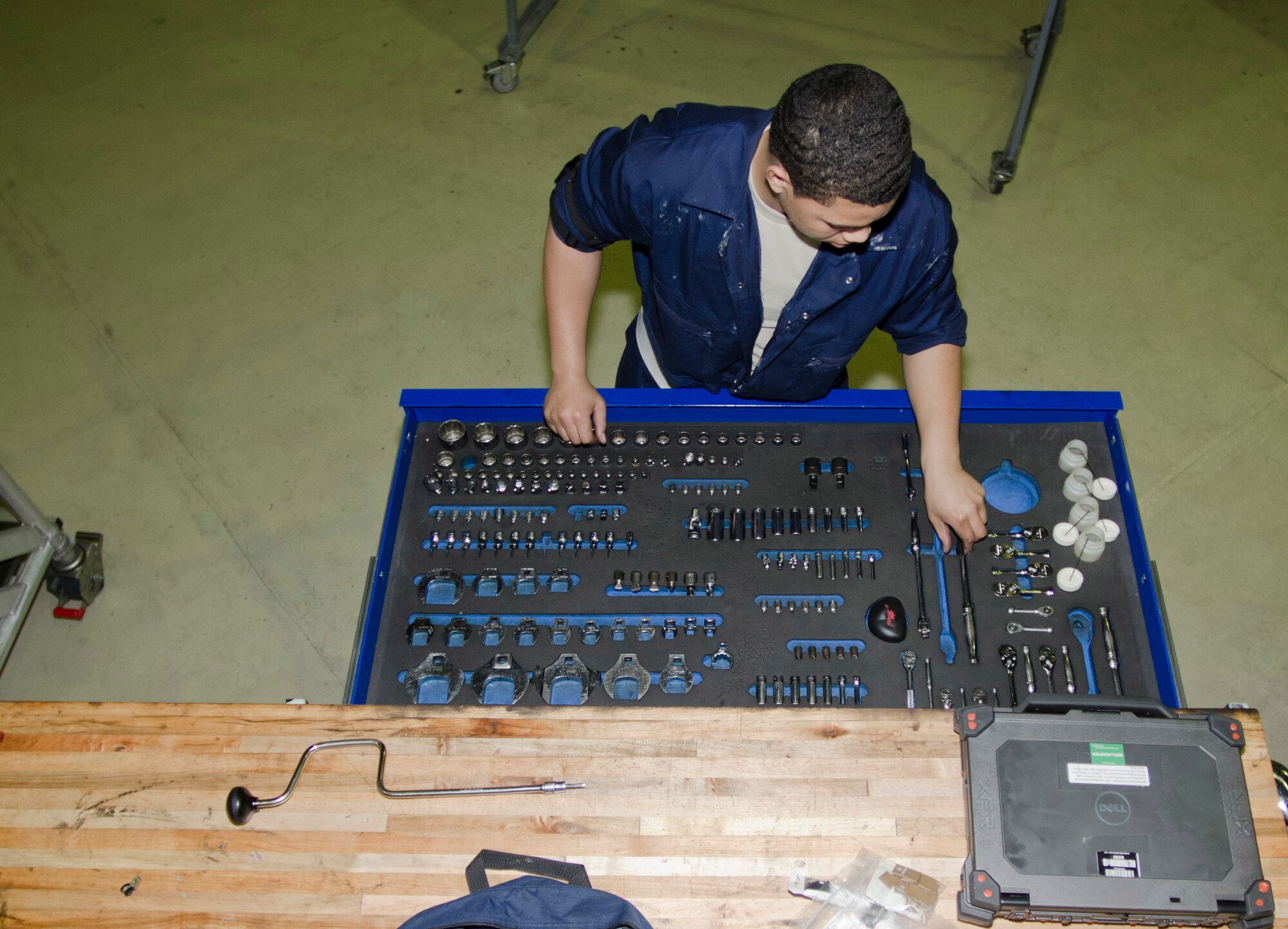 ROYAL AIR FORCE LAKENHEATH, England - Airman 1st Class Matthew Anthony, 48th Equipment Maintenance inspection section apprentice and native of Atlanta, searches a tool box for the right tool while working on an F-15C Eagle Oct. 17, 2012. Airmen from the 48th EMS inspect, restore and upgrade aircraft during a 10-day maintenance process known as phase maintenance. (U.S. Air Force Photo by Staff Sgt. Stephen Linch)
