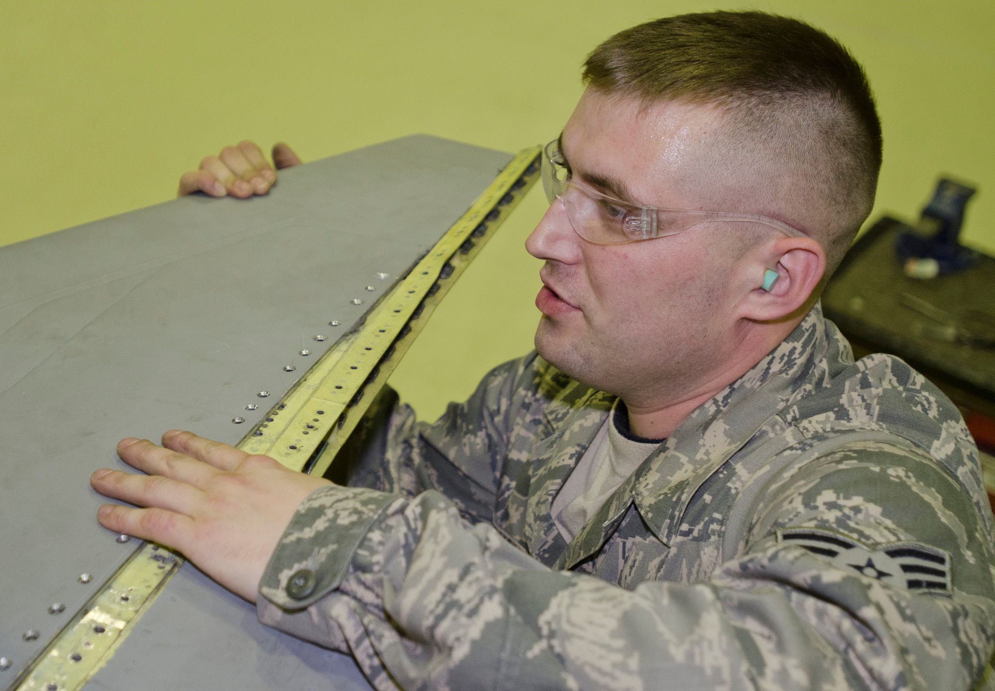 ROYAL AIR FORCE LAKENHEATH, England - Senior Airman Christopher Maskovish, 48th Equipment Maintenance Squadron aircraft structural journeyman and native of Pierre, S.D., replaces the wing tip of an F-15C Eagle Oct. 16, 2012. This aircraft was turned over to the 48th EMS for 10 days of phase maintenance. During the maintenance, the 48th EMS Airmen essentially reverse 400 flight hours of wear and tear. (U.S. Air Force Photo by Staff Sgt. Stephen Linch)