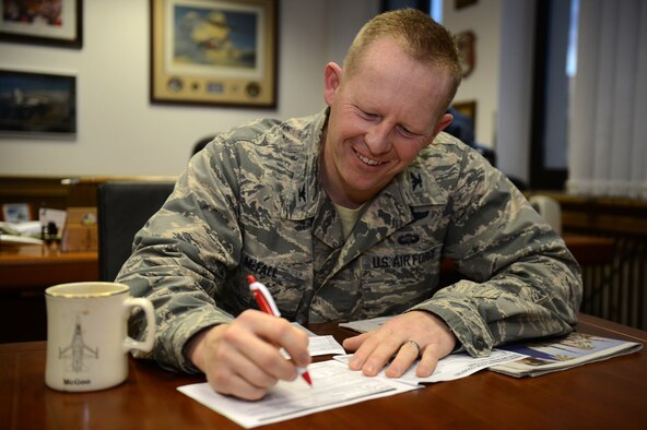 SPANGDAHLEM AIR BASE, Germany – U.S. Air Force Col. Joseph McFall, 52nd Fighter Wing vice commander from Maple Valley, Wash., signs a Combined Federal Campaign Overseas pledge card at the 52nd FW headquarters building Oct. 17, 2012. The Spangdahlem CFC ends Nov. 16. People can still donate through unit coordinators or online at http://www.cfcoverseas.org. The CFC has more than 200 campaigns throughout the world to help to raise millions of dollars for eligible non-profit organizations each year. (U.S. Air Force photo by Airman 1st Class Gustavo Castillo/Released) 