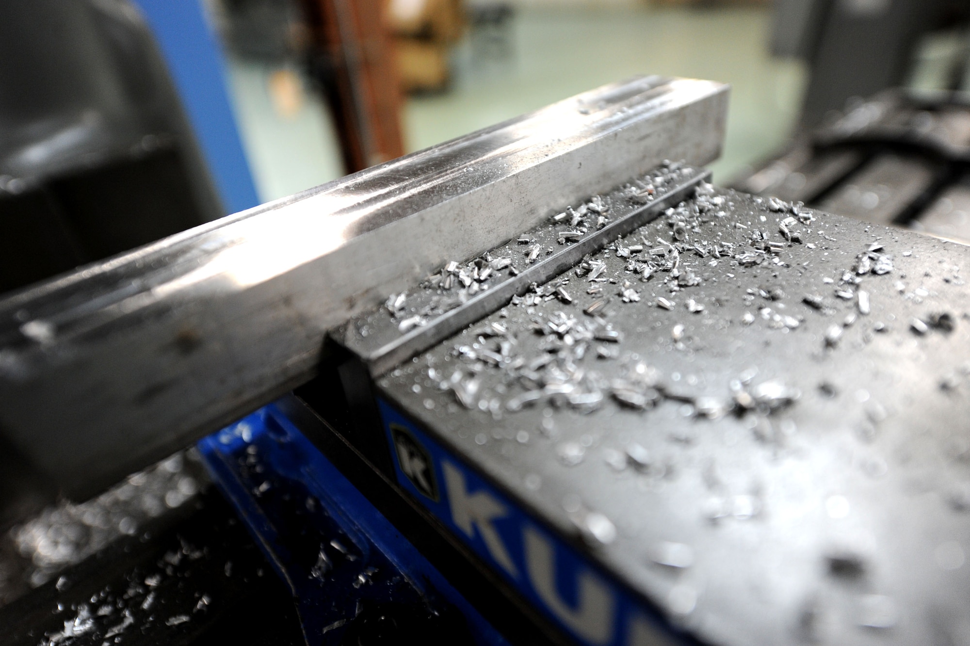 Metal chips lay scattered after a piece of metal was smoothed down on Kadena Air Base, Japan, Oct. 18, 2012. The metal shop supports the F-15s, KC-135s and HH-60s, and provides limited maintenance for transient and associate unit aircraft. (U.S. Air Force photo/ Airman 1st Class Brooke P. Beers)