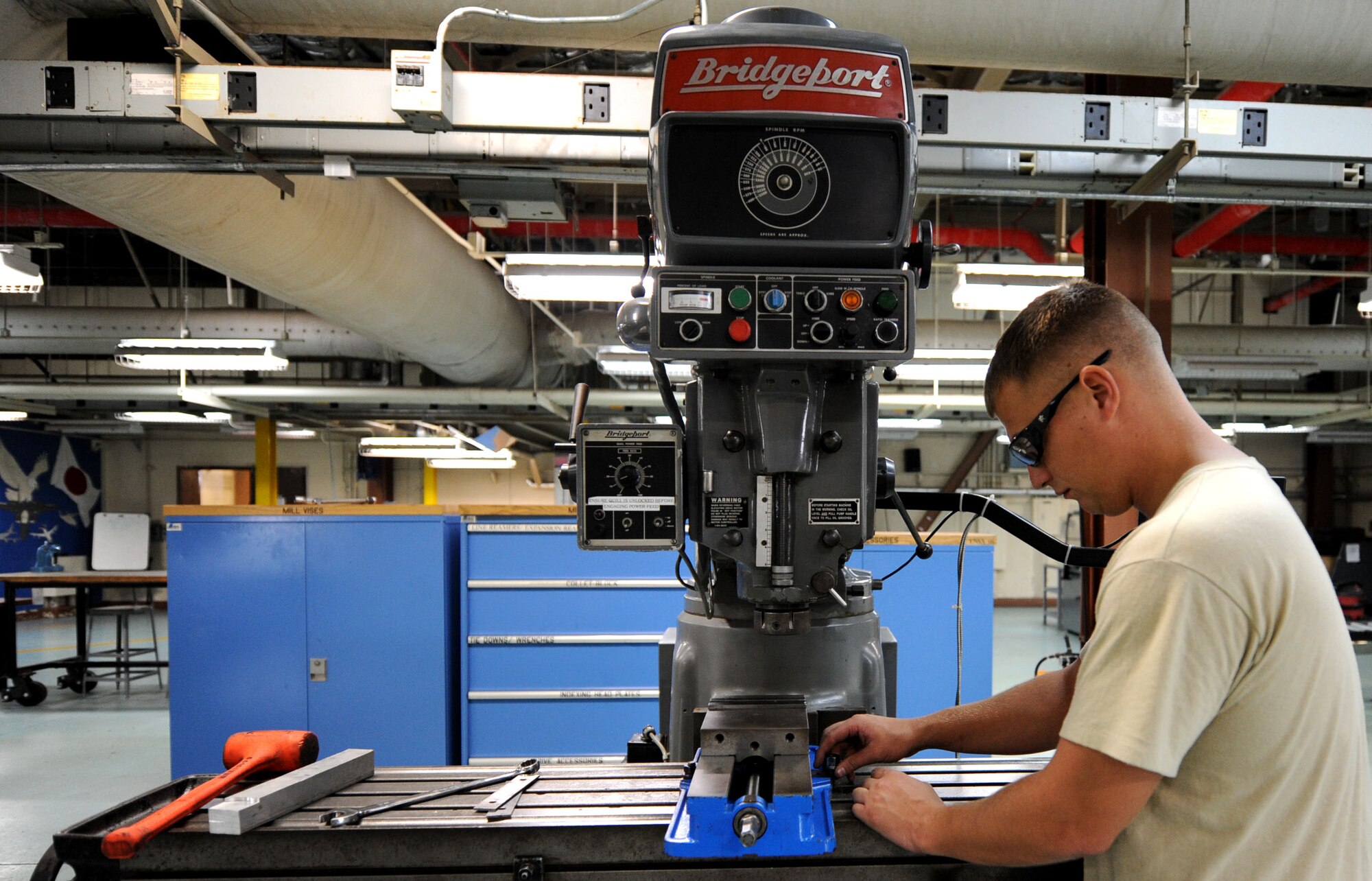 U.S. Air Force Staff Sgt. Cody Hodges, 18th Equipment Maintenance Squadron aircraft metals technology craftsman, prepares to smooth down metal down to size on Kadena Air Base, Japan, Oct. 18, 2012. The unit provides metal work for all the aircraft located on Kadena. (U.S. Air Force photo/ Airman 1st Class Brooke P. Beers)