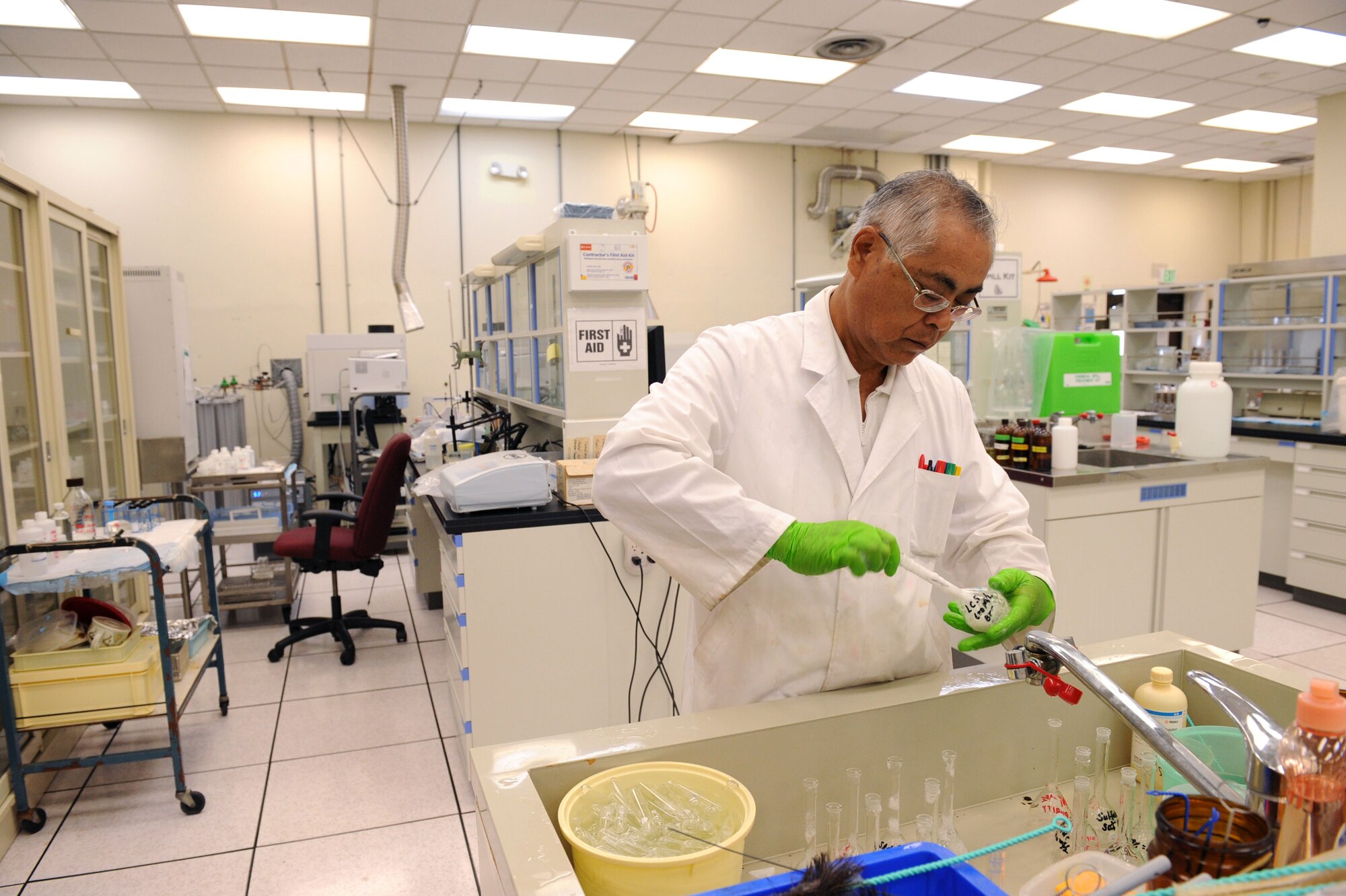 Teruaki Gushiken, United States Air Force School of Aerospace Medicine - Detachment 3 chemist, cleans test tubes on Kadena Air Base, Oct. 18, 2012. The detachment conducts all the tests for PACAF concerning occupational health and waste disposal. (U.S. Air Force photo/Airman 1st Class Brooke P. Beers)