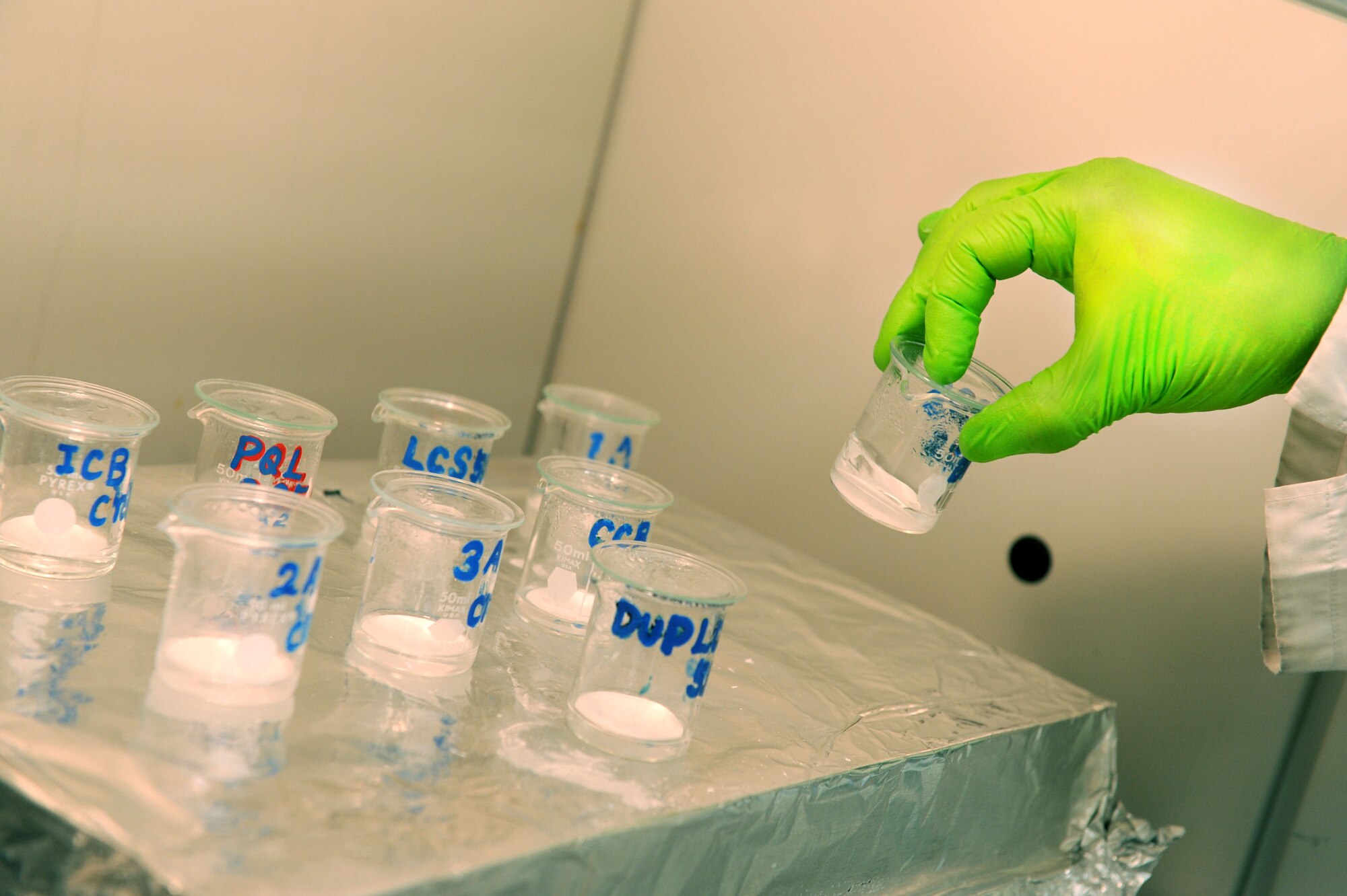 Teruaki Gushiken, Det. 3 United States Air Force School of Aerospace Medicine chemist, checks on a sample that has been digesting on Kadena Air Base, Oct. 18, 2012. The detachment composed of four civilians and four Airmen tests samples from around the base and PACAF concerning occupational health and waste disposal. (U.S. Air Force photo/Airman 1st Class Brooke P. Beers)