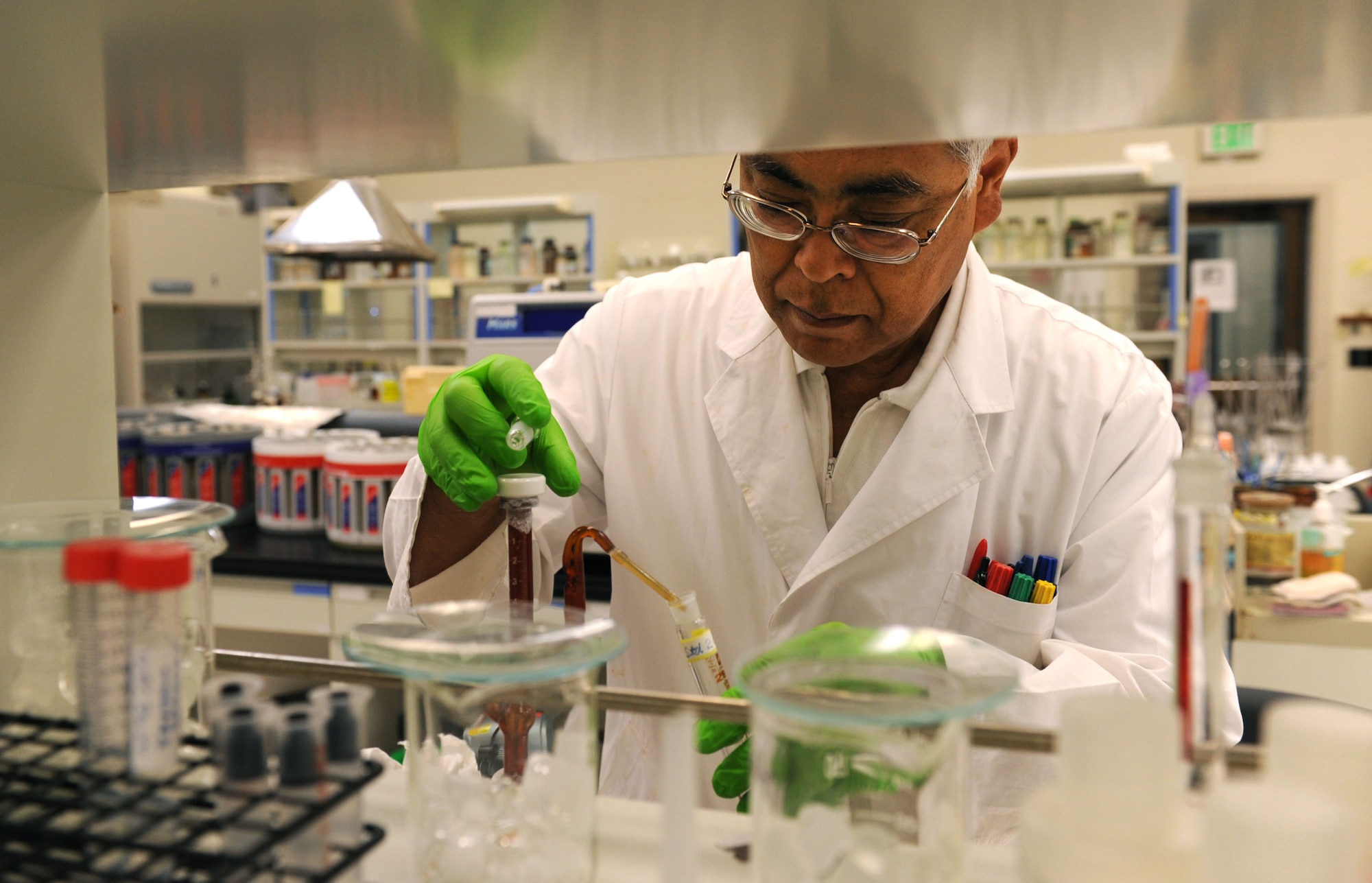 Teruaki Gushiken, United States Air Force School of Aerospace Medicine - Detachment 3 chemist, sets up a test on Kadena Air Base, Oct. 18, 2012. The detachment is in charge of testing various samples to make sure that PACAF units have the proper occupational health and waste disposal. (U.S. Air Force photo/Airman 1st Class Brooke P. Beers)