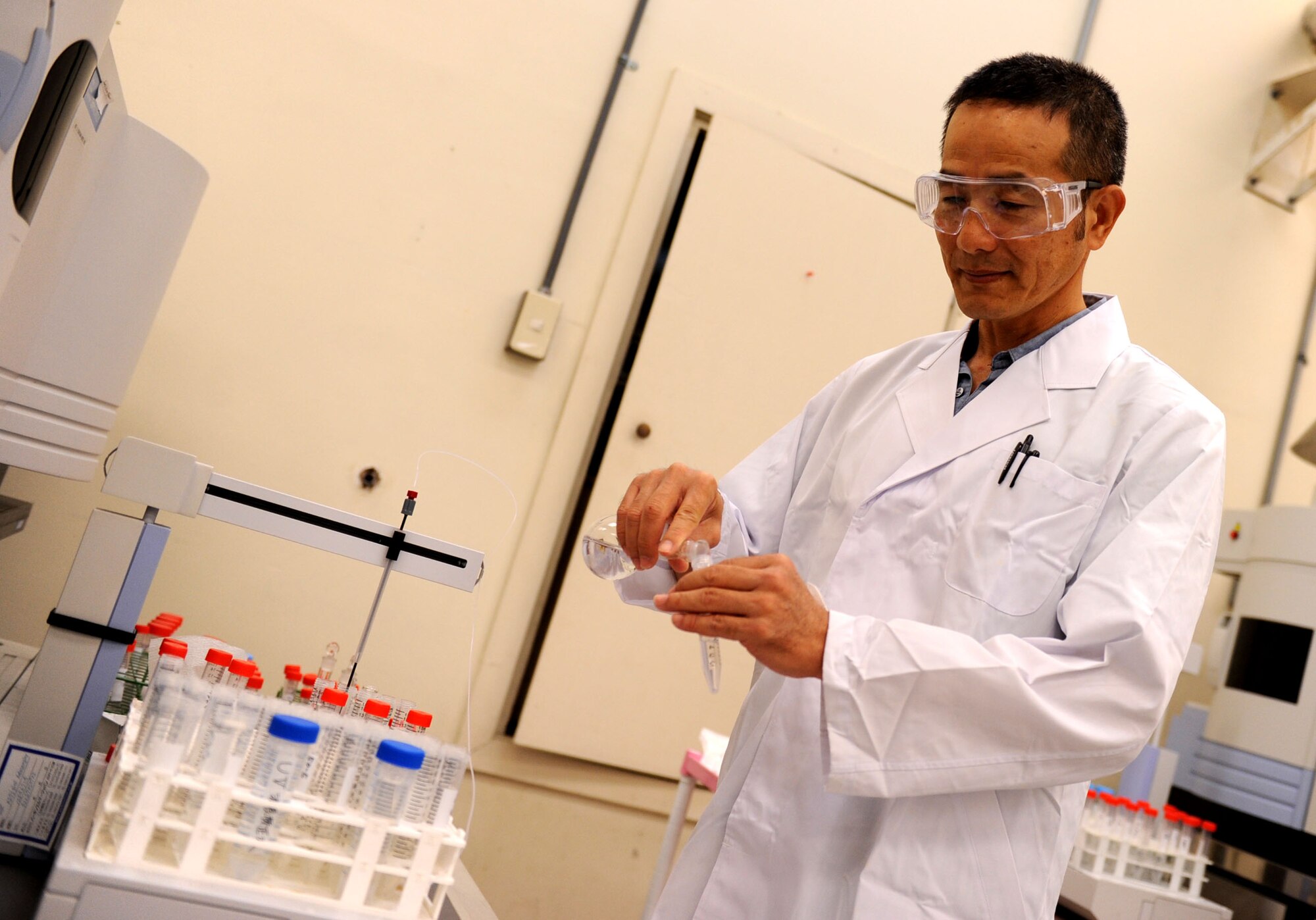 Toru Kikunaga, United States Air Force School of Aerospace Medicine - Detachment 3 chemist, prepares a sample for testing on Kadena Air Base, Oct. 18, 2012. The detachment tests samples from around the base concerning occupational health and waste disposal. (U.S. Air Force photo/Airman 1st Class Brooke P. Beers)