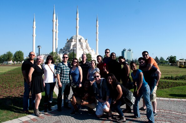 Tops in Blue members and Ahmet Kocacay, 39th Force Support Squadron, pose in front the Sabanci mosque in Adana, Turkey, Oct. 14, 2012. The Sabanci mosque is the largest mosque in the Middle East. (U.S. Air Force photo by Senior Airman Daniel Phelps/Released)