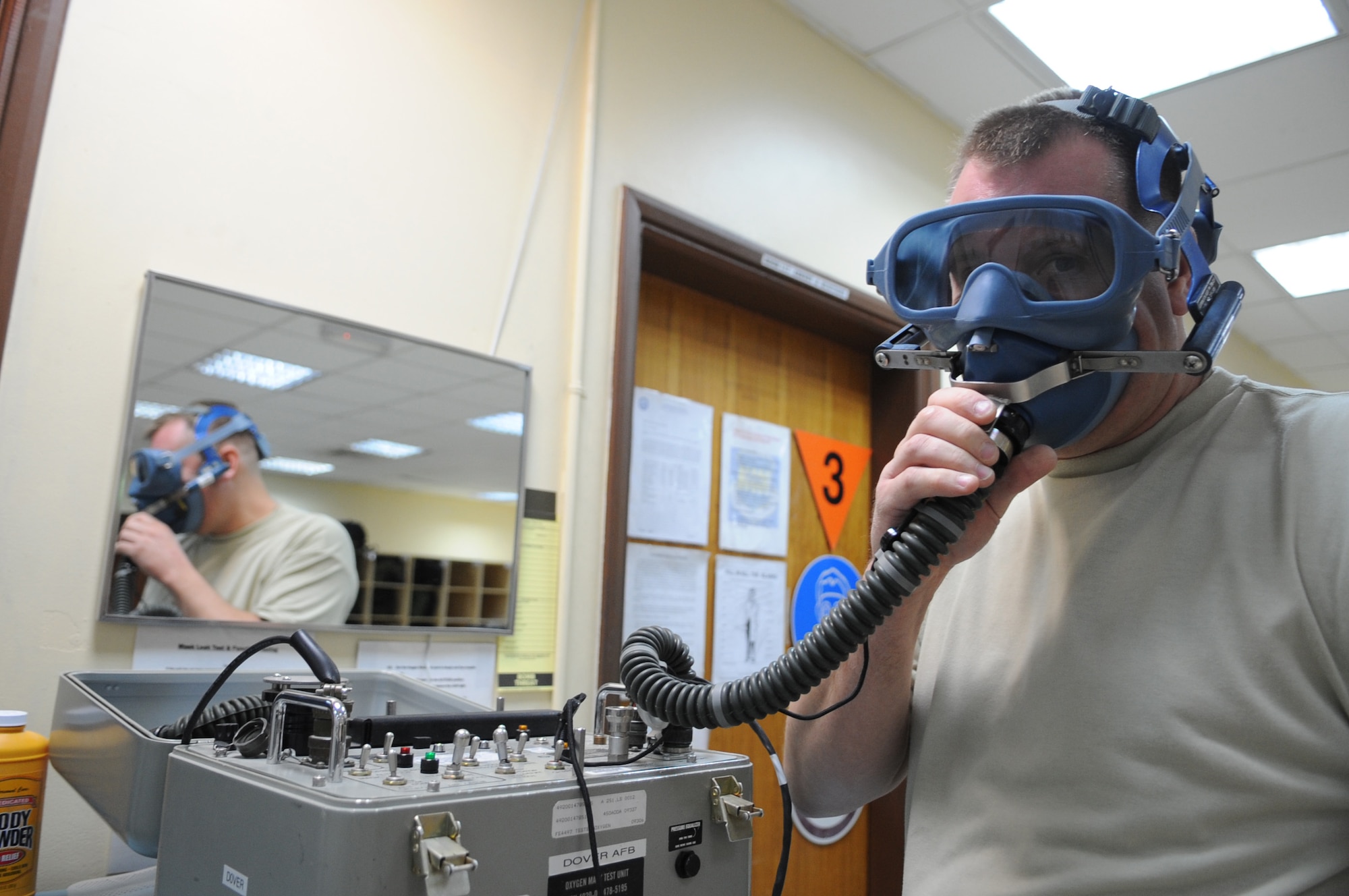 SOUTHWEST ASIA – Senior Airman Brian Storzer, 386th Expeditionary Operations Support Squadron aircrew flight equipment technician, checks the pressure on a quick-don mask here Oct. 13. Storzer and his team are responsible for ensuring aircrews have life-saving equipment available to complete their assigned mission. (U.S. Air Force photo/Staff Sgt. Alexandra M. Boutte)