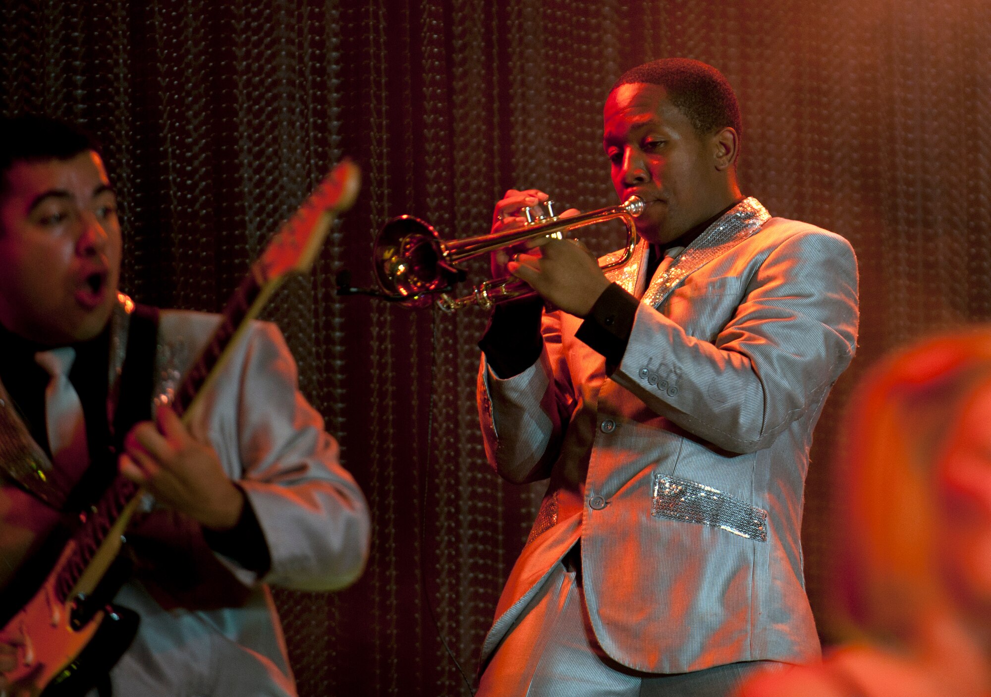 Staff Sgt. Anthony Williams, 633rd Civil Engineer Squadron firefighter and Tops in Blue instrumentalist, plays the trumpet during a concert at Incirlik Air Base, Turkey, Oct. 13, 2012. Tops in Blue entertains Airmen and their families, coalition partners and audiences around the world with musical theatrics. (U.S. Senior Airman Daniel Phelps/Released)
