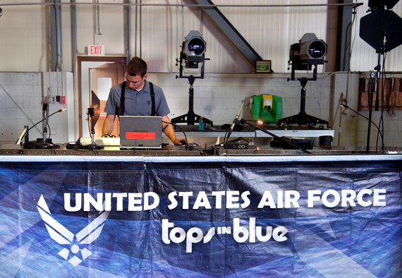 Senior Airman Julian Saviano, 10th Intelligence Squadron cyber transportation systems journeyman and Tops in Blue audio director, sets up the sound board for the evening’s concert at Incirlik Air Base, Turkey, Oct. 13, 1012. This year’s Tops in Blue tour took audience members on a musical journey through time and various artists from The Doobie Brothers and Mariah Carey to Maroon 5 and Darius Rucker. (U.S. Senior Airman Daniel Phelps/Released)