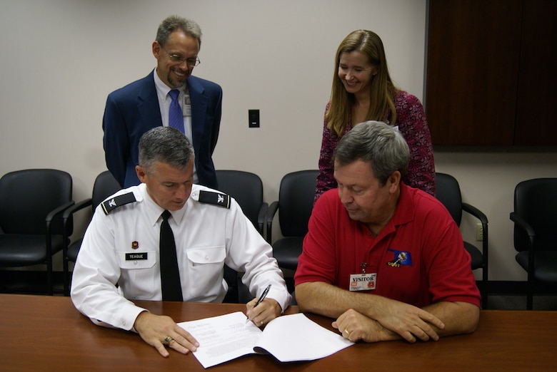 Tulsa District commander, Col. Michael Teague and David Streb, Oklahoma Department of Transportation director of engineering sign a memorandum of agreement between the two agencies.