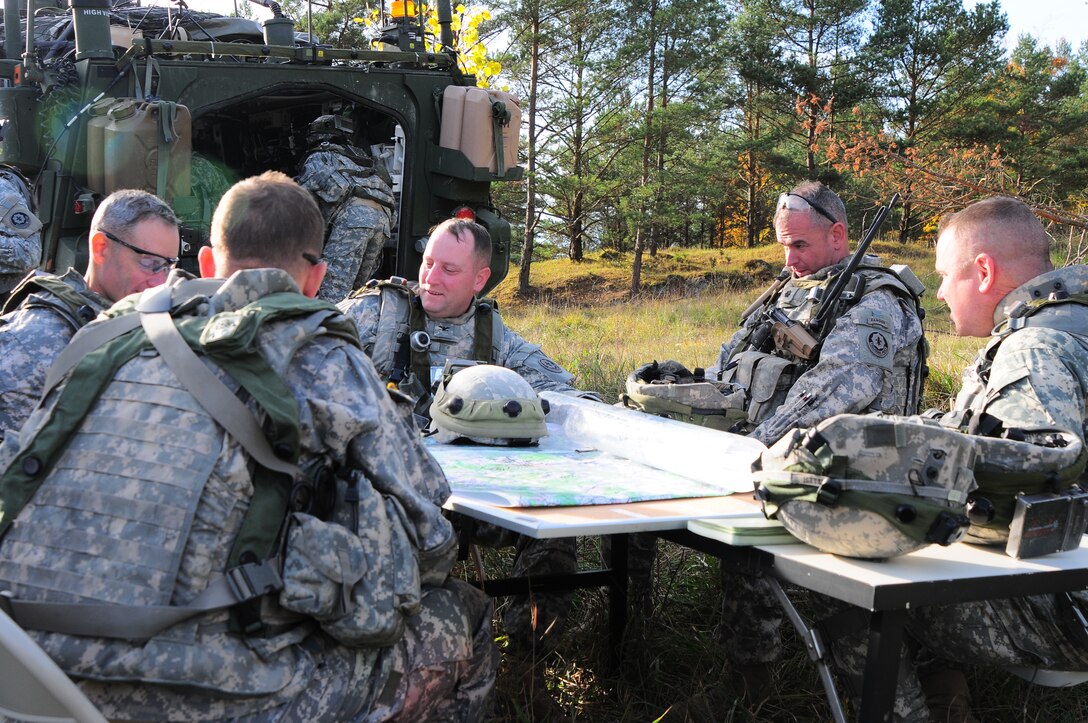 U.S Army Col. Keith Barclay, center, conducts a briefing during Saber Junction 2012, at the Grafenwoehr Training Area in Grafenwoehr, Germany, Oct. 17, 2012. Saber Junction 2012, the U.S. Army Europe’s premier training event, is a large-scale, joint, multinational, military exercise with 19 participating nations. 