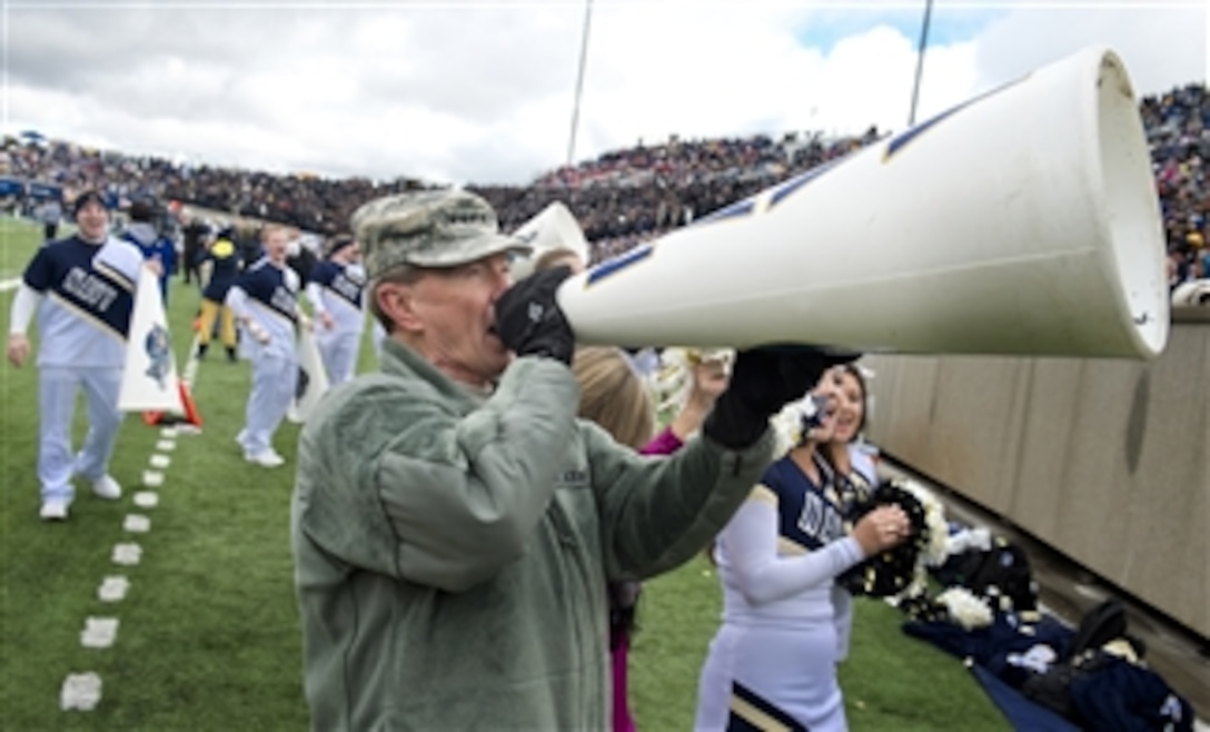 Chairman of the Joint Chiefs of Staff Gen. Martin E. Dempsey encourages football fans at the Navy versus Air Force game in Colorado Springs, Colo., on Oct. 6, 2012