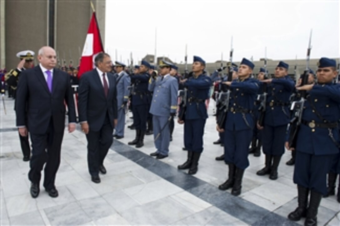 Peruvian Minister of Defense Pedro Cateriano Bellido, left, escorts Secretary of Defense Leon E. Panetta as he inspects the troops at an honors ceremony in Lima, Peru, on Oct. 6, 2012.  Panetta is visiting South America on a four-day trip to strengthen defense relationships with Western Hemisphere counterparts. He will attend the 10th Conference of Defense Ministers of the Americas this week in Uruguay.  