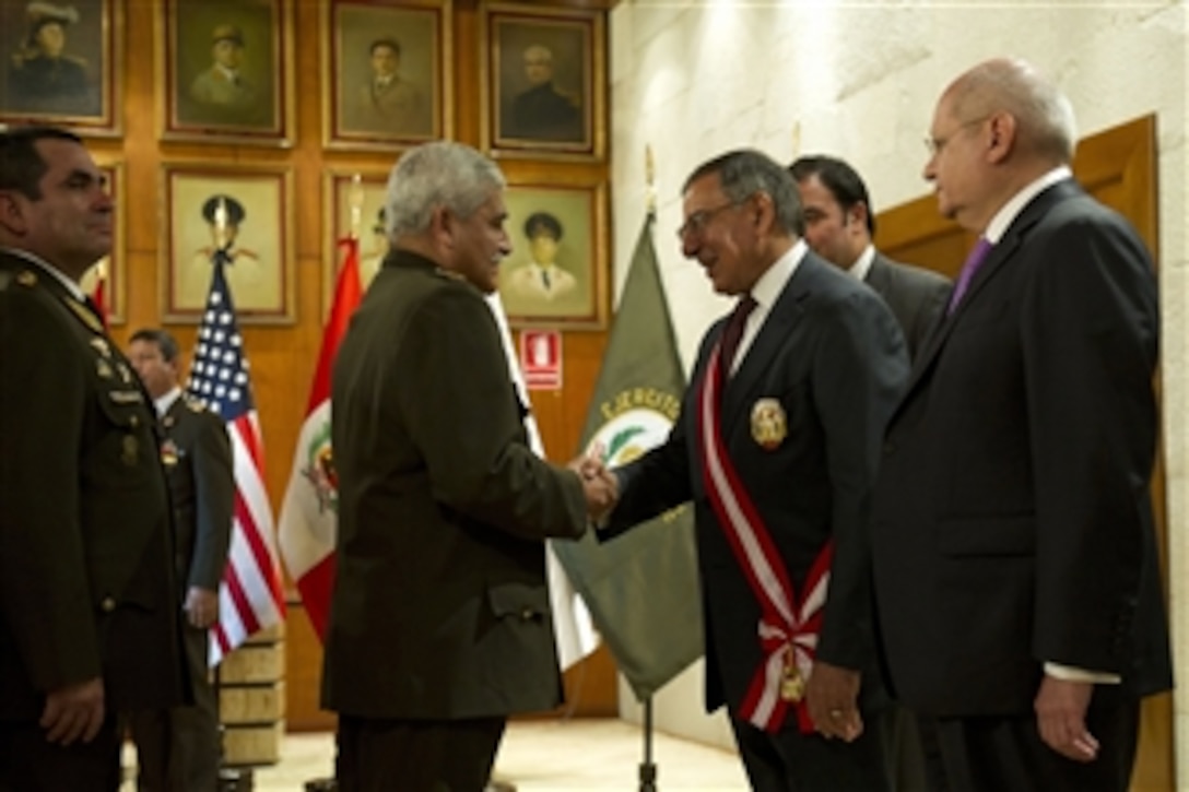 Secretary of Defense Leon E. Panetta, second from right, and Peruvian Minister of Defense Pedro Cateriano Bellido, right, shake hands with members of the Peruvian military after a decoration ceremony where Panetta was presented with the Ayachcho Military Order in Lima, Peru, on Oct. 6, 2012.  Panetta is visiting South America on a four-day trip to strengthen defense relationships with Western Hemisphere counterparts. He will attend the 10th Conference of Defense Ministers of the Americas this week in Uruguay.  