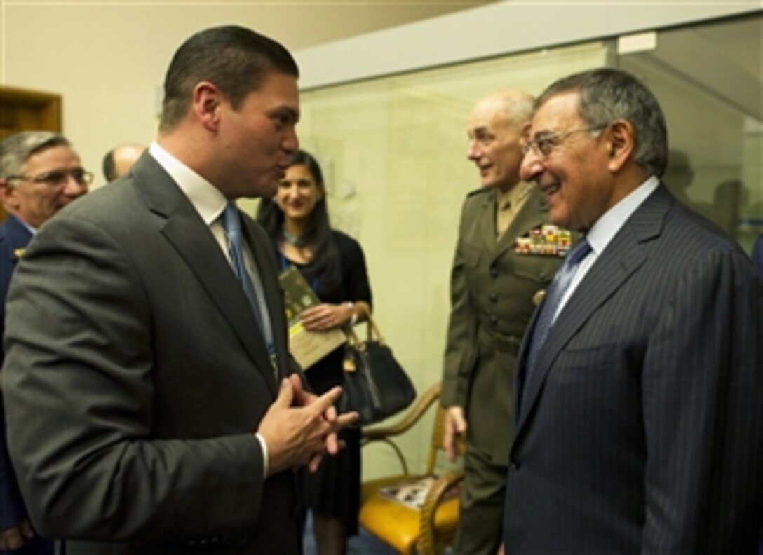 Secretary of Defense Leon E. Panetta, right, talks with Colombian Minister of Defense Juan Carlos Pinzon Bueno, left, at a conference for Defense Ministers in Punta del Este, Uruguay, on Oct 7, 2012.  Panetta is in Uruguay to attend the 10th Conference of Defense Ministers of the Americas as part of a four-day trip to strengthen defense relationships with Western Hemisphere counterparts.  