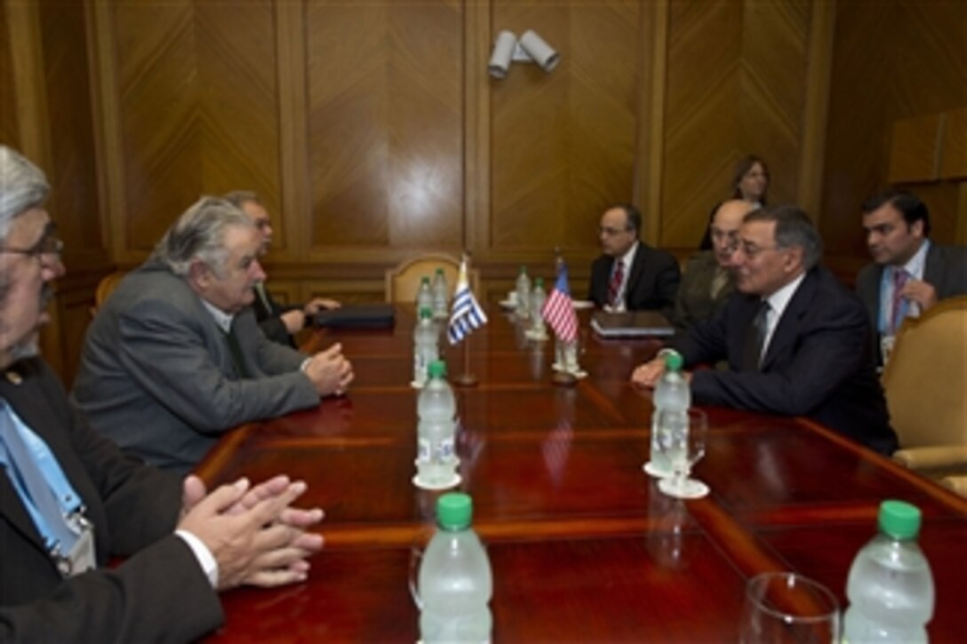 Secretary of Defense Leon E. Panetta, right, meets with President of Uruguay Jose Mujica, second from left, at a conference for defense ministers in Punta del Este, Uruguay, on Oct 8, 2012.  Panetta is in Uruguay to attend the 10th Conference of Defense Ministers of the Americas as part of a four-day trip to strengthen defense relationships with Western Hemisphere counterparts.  