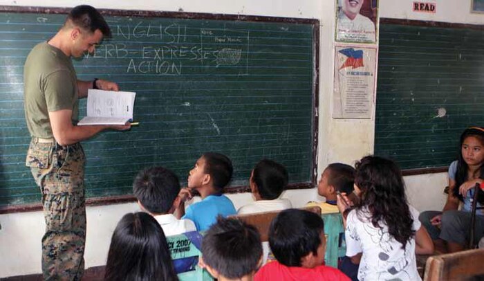 Petty Officer 3rd Class Gregory Lafer teaches a class at Bahile Elementary School, Puerto Princesa, Republic of the Philippines, Oct.
11 during PHIBLEX 2013. Marines and sailors helped teach English to children at the school during one of many community relations events held as part of PHIBLEX 2013. Lafer is a corpsman with Combat Logistics Battalion 31, 31st Marine Expeditionary Unit, III
Marine Expeditionary Force.