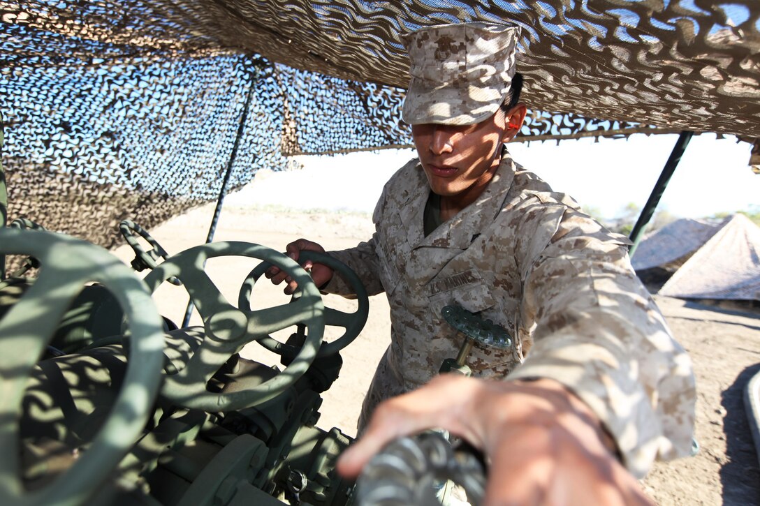 20-year-old Lance Cpl. Erwin Diaz, from Los Angeles, a bulk fuel specialist with Bulk Fuel 
Company, 7th Engineer Support Battalion, 1st Marine Logistics Group, inspects fuel valves during a field training exercise at Camp Pendleton, Calif., Oct. 15. Bulk fuel specialists constructed a 320,000-gallon storage facility to support the field exercise.
