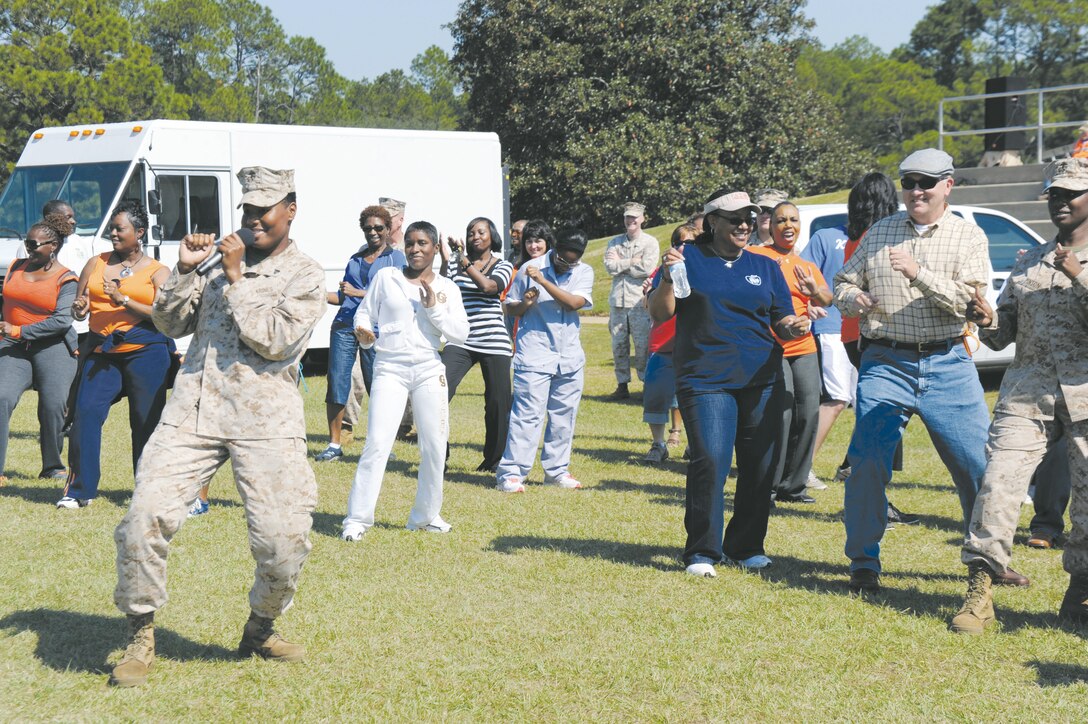 Cpl. Stephanie A. Bowens leads Marines and Civilian-Marines in a wobble dance during Marine Corps Logistics Base Albany’s Employee Recognition Day at Covella Pond, Oct. 11.