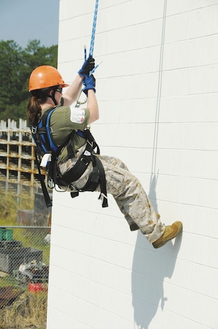 A spouse rappels down Marine Corps Logistic Base Albany’s rappel tower during Jane Wayne Day, Oct. 12. Jane Wayne Day fosters a greater understanding, appreciation and perspective of the Marine Corps lifestyle for spouses.

