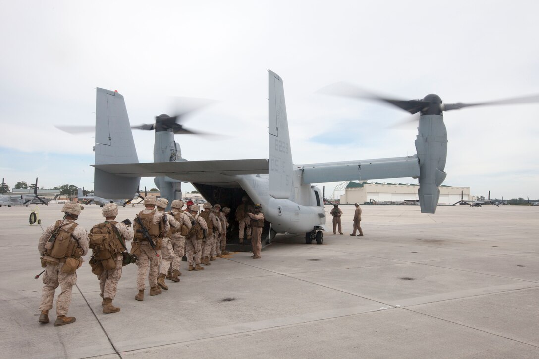 Marines with Weapons Company, Battalion Landing Team (BLT) 3/2, 26th Marine Expeditionary Unit (MEU), board an MV-22B Osprey at Marine Corps Air Station New River, N.C., Oct. 17, 2012. The Marines conducted a notional tactical recovery of aircraft and personnel mission in preparation for an upcoming deployment. The 26th MEU is slated to deploy in 2013.
