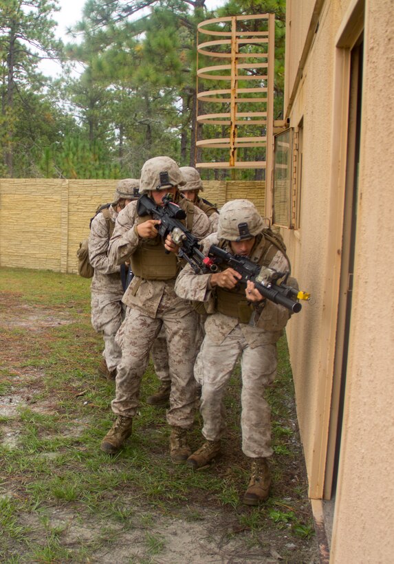 Marines of Company K, Battalion Landing Team (BLT) 3/2, currently reinforcing the 26th Marine Expeditionary Unit (MEU), stack on a door during the mechanized raid course at Camp Lejeune, N.C., Oct. 10, 2012. BLT 3/2 is one of the three reinforcements of 26th MEU, which is slated to deploy in 2013.